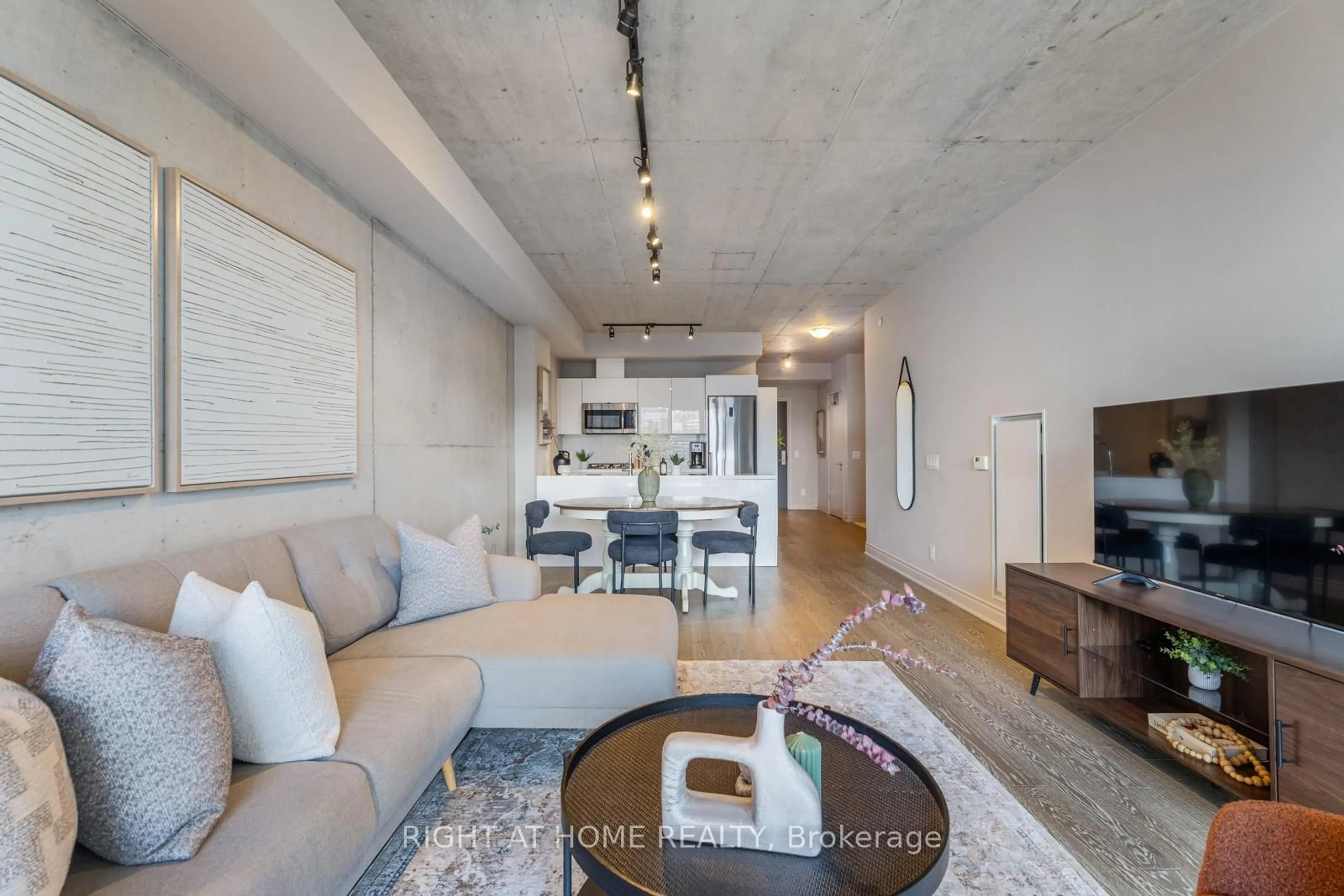 Living room with furniture, cement floor for 608 Richmond St #320, Toronto Ontario M5V 0N9