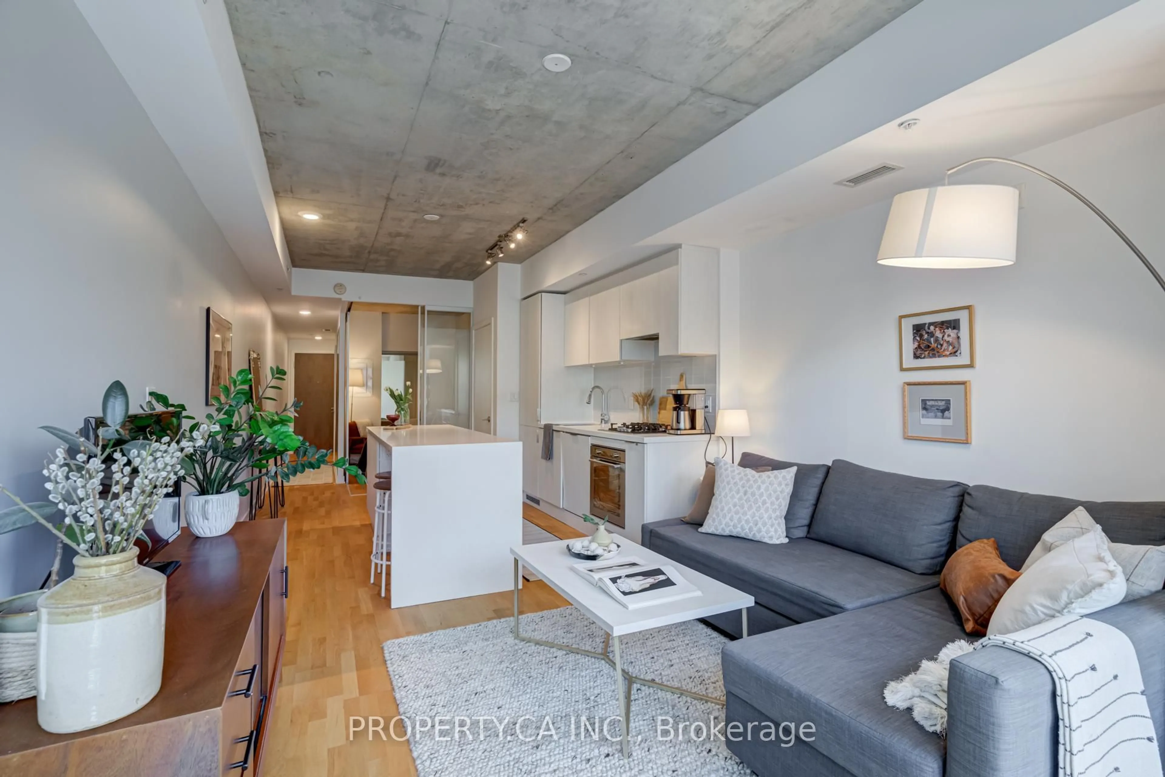 Open concept kitchen, cement floor for 109 Ossington Ave #203, Toronto Ontario M6J 0G1
