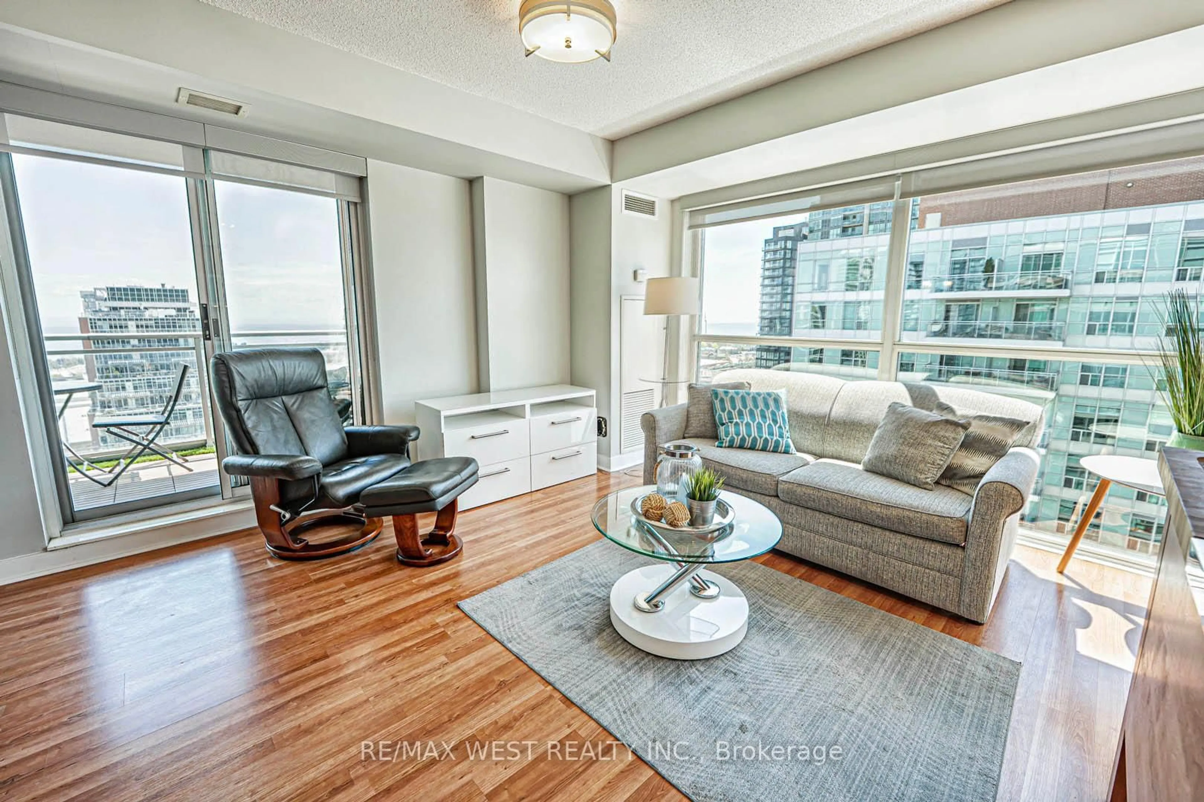 Living room with furniture, wood/laminate floor for 80 Western Battery Rd #2311, Toronto Ontario M6K 3S1