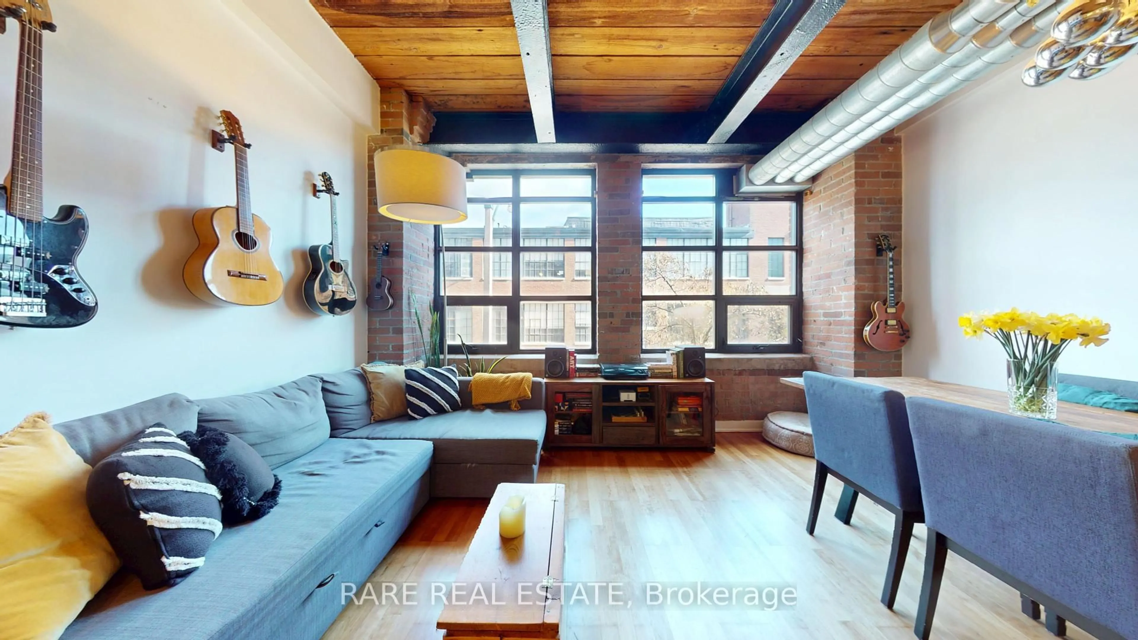 Living room with furniture, unknown for 43 Hanna Ave #217, Toronto Ontario M6K 1X1