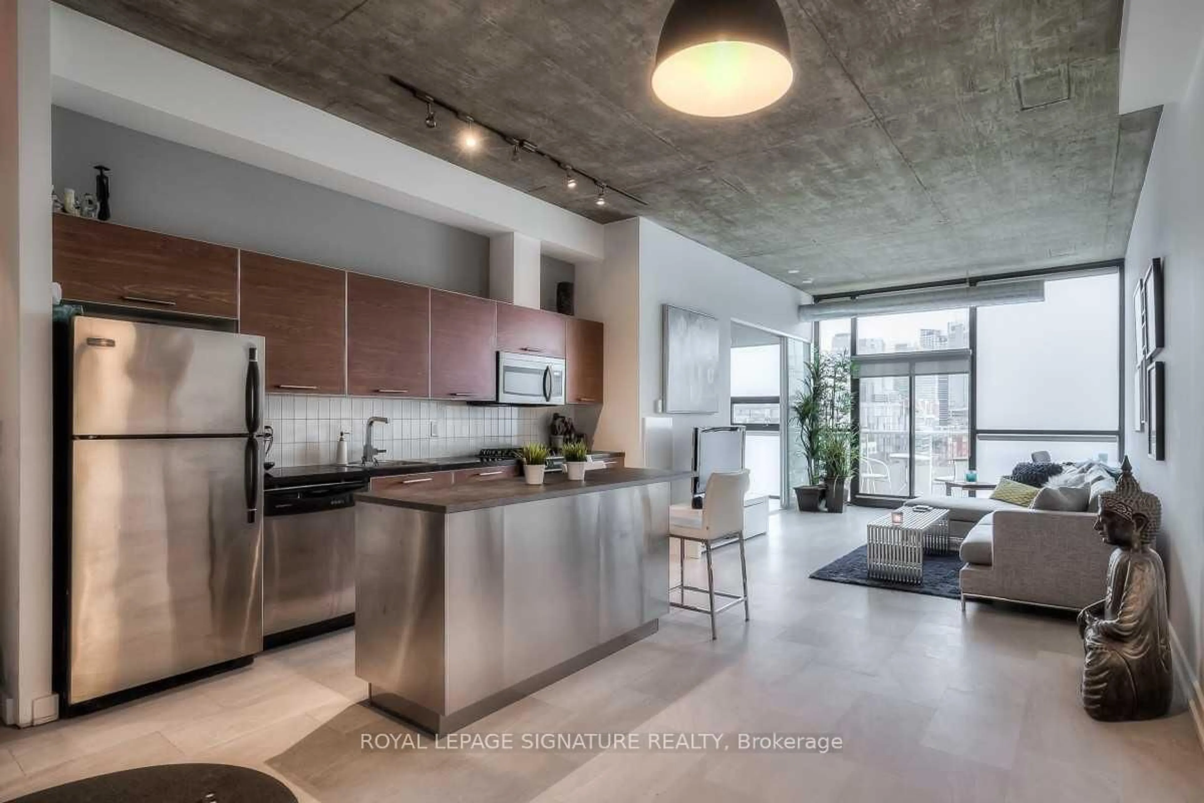 Open concept kitchen, cement floor for 60 Bathurst St #909, Toronto Ontario M5V 2P4