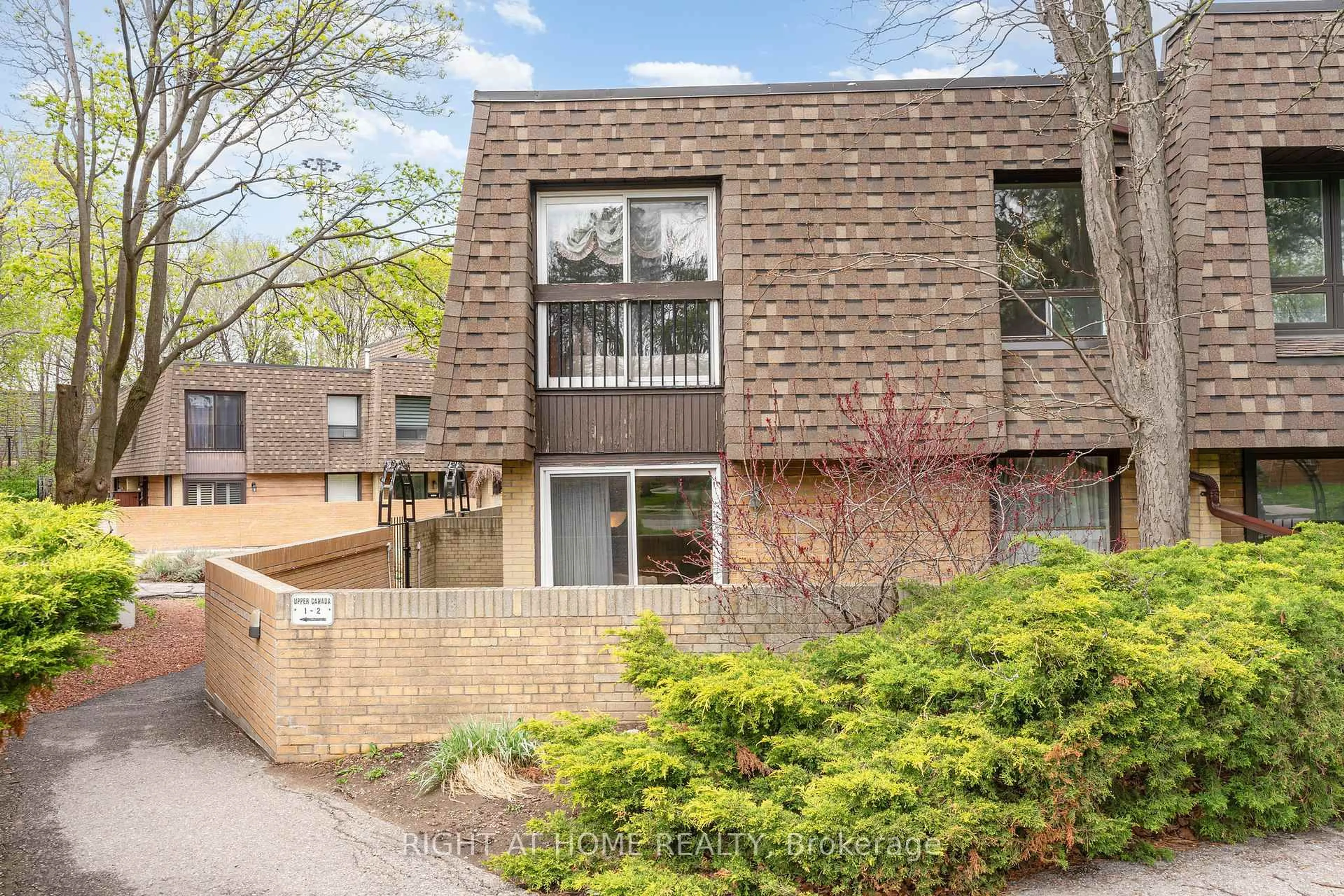 Home with brick exterior material, street for 74 Upper Canada Dr #1, Toronto Ontario M2P 2A3