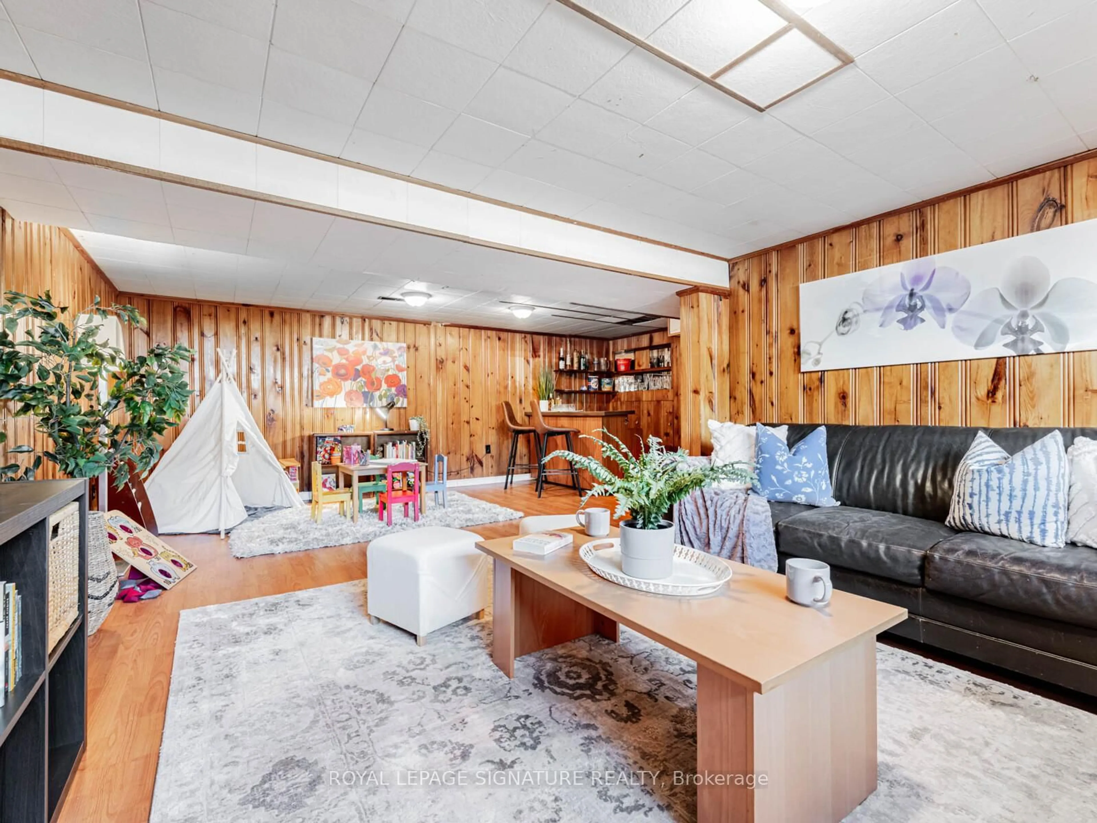 Living room with furniture, wood/laminate floor for 43 Hemford Cres, Toronto Ontario M3B 2S4