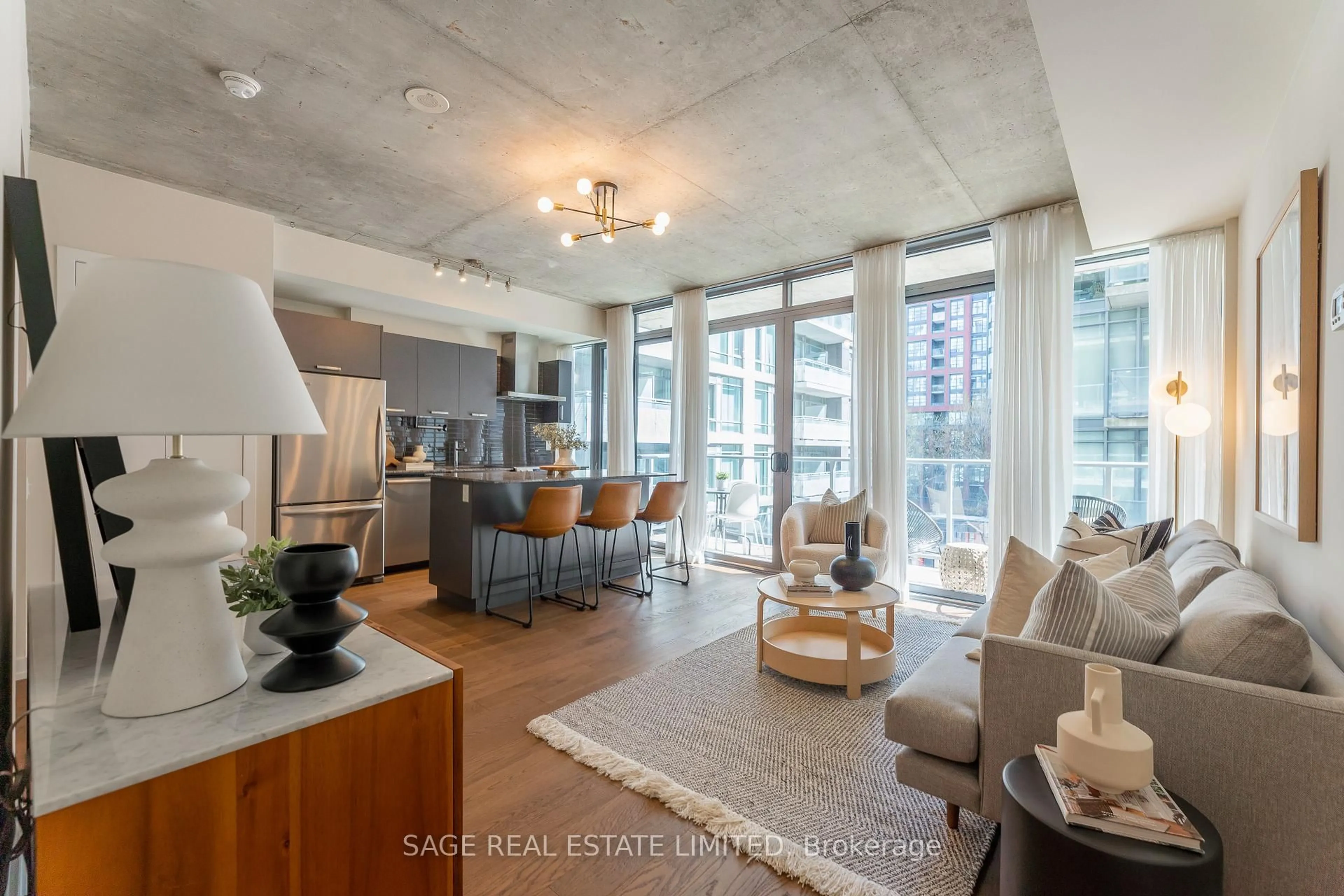 Open concept kitchen, cement floor for 95 Bathurst St #516, Toronto Ontario M5V 0H7