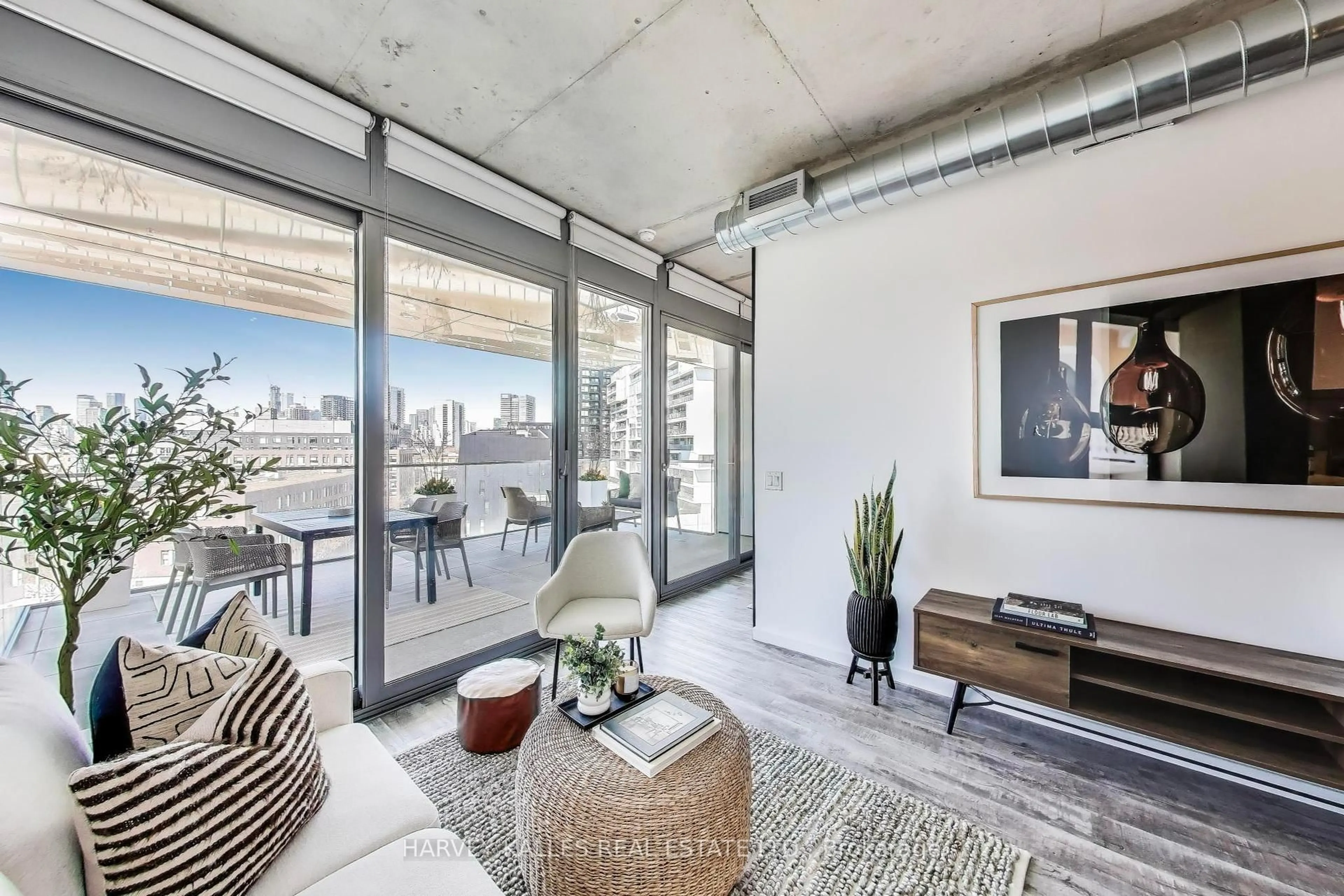 Living room with furniture, cement floor for 170 Bayview Ave #710, Toronto Ontario M5A 0M4