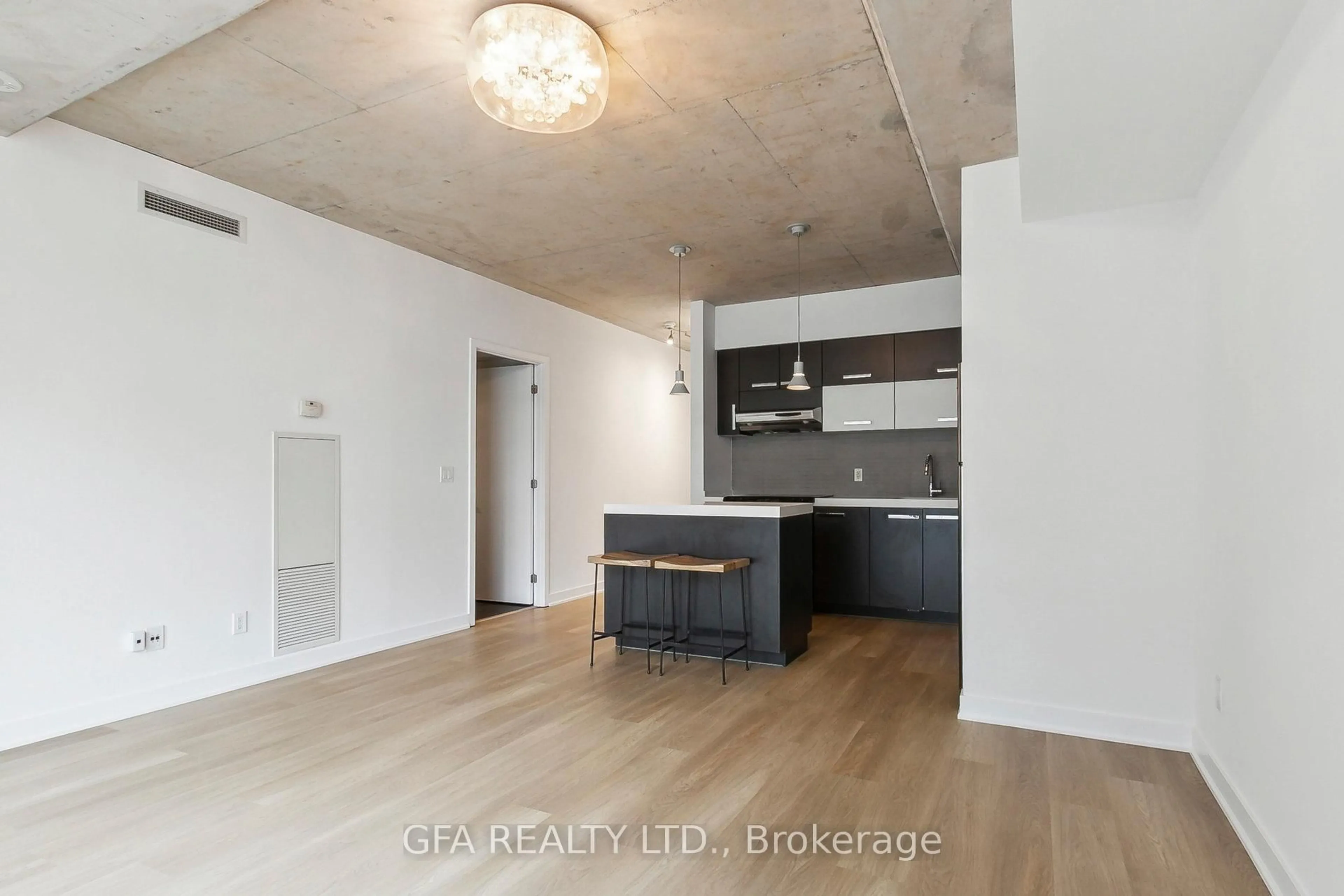 Open concept kitchen, cement floor for 55 Stewart St #413, Toronto Ontario M5V 2V1