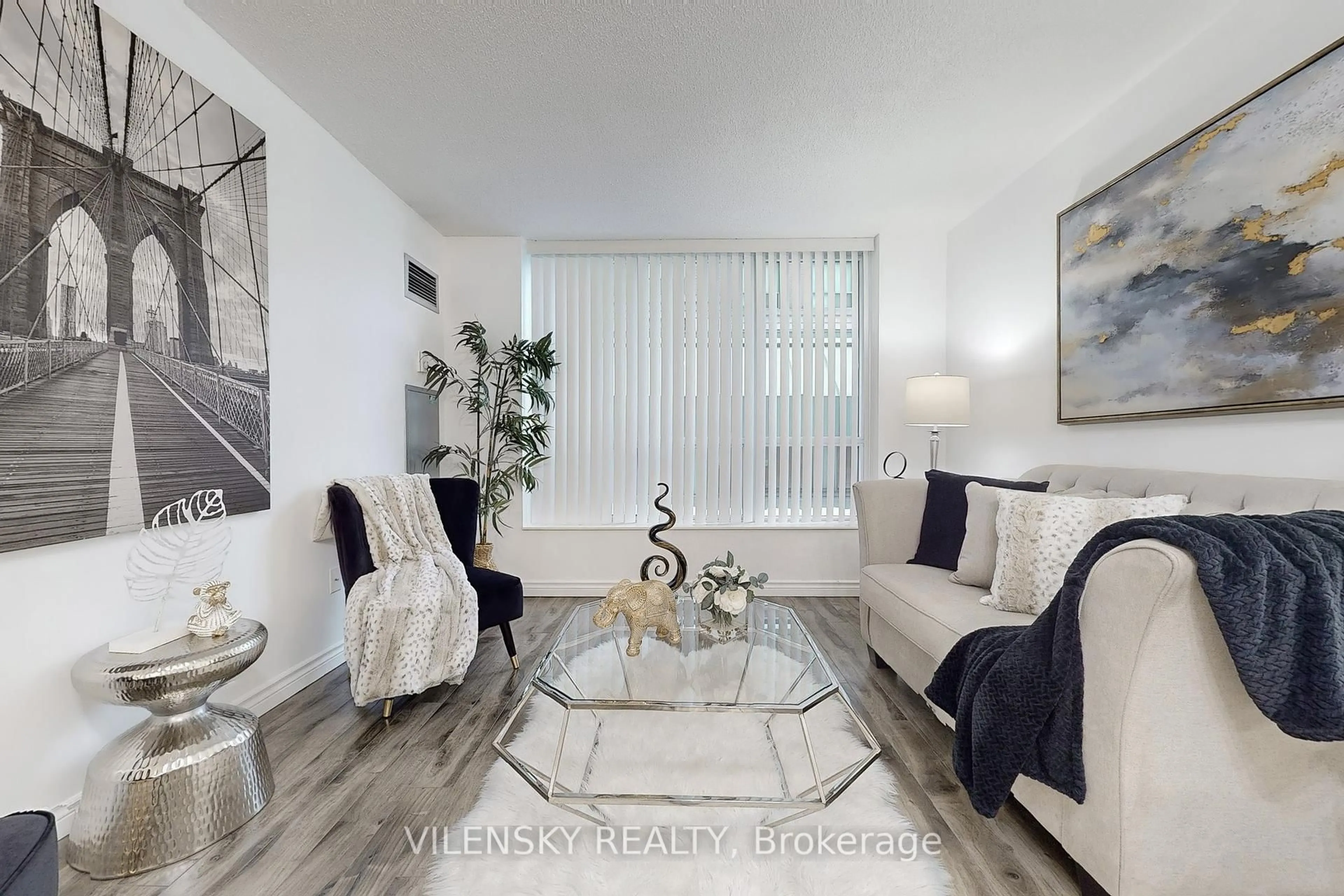 Living room with furniture, wood/laminate floor for 29 Pemberton Ave #207, Toronto Ontario M2M 4L5