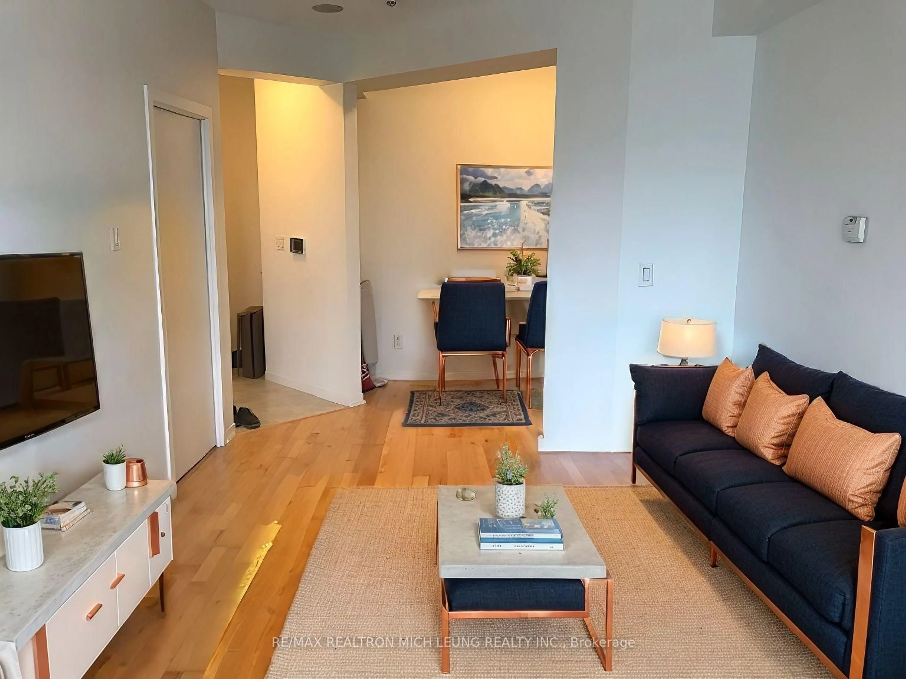 Living room with furniture, unknown for 55 Bremner Blvd #1704, Toronto Ontario M5J 0A6
