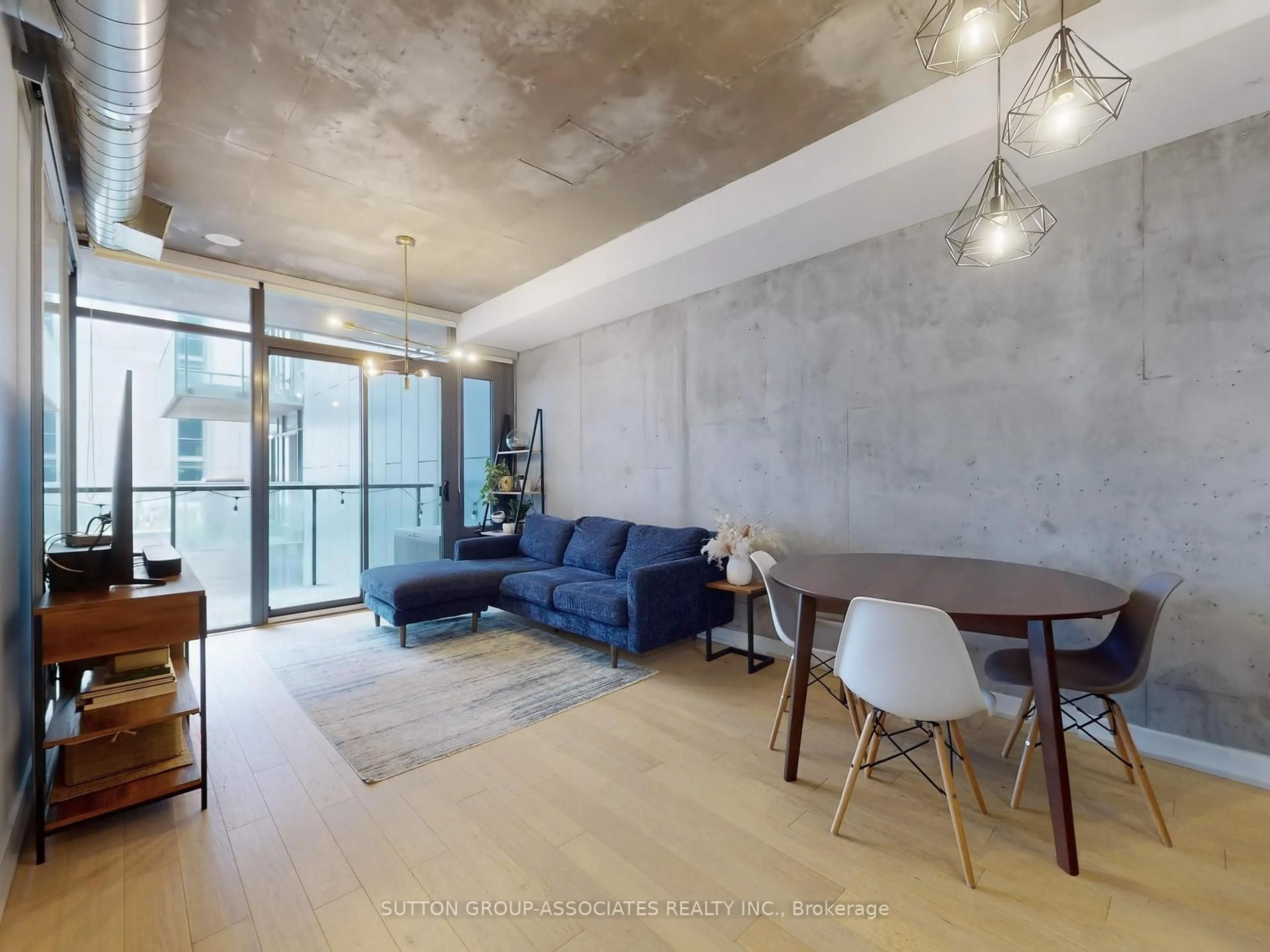 Living room with furniture, cement floor for 138 Princess St #811, Toronto Ontario M5A 0B1