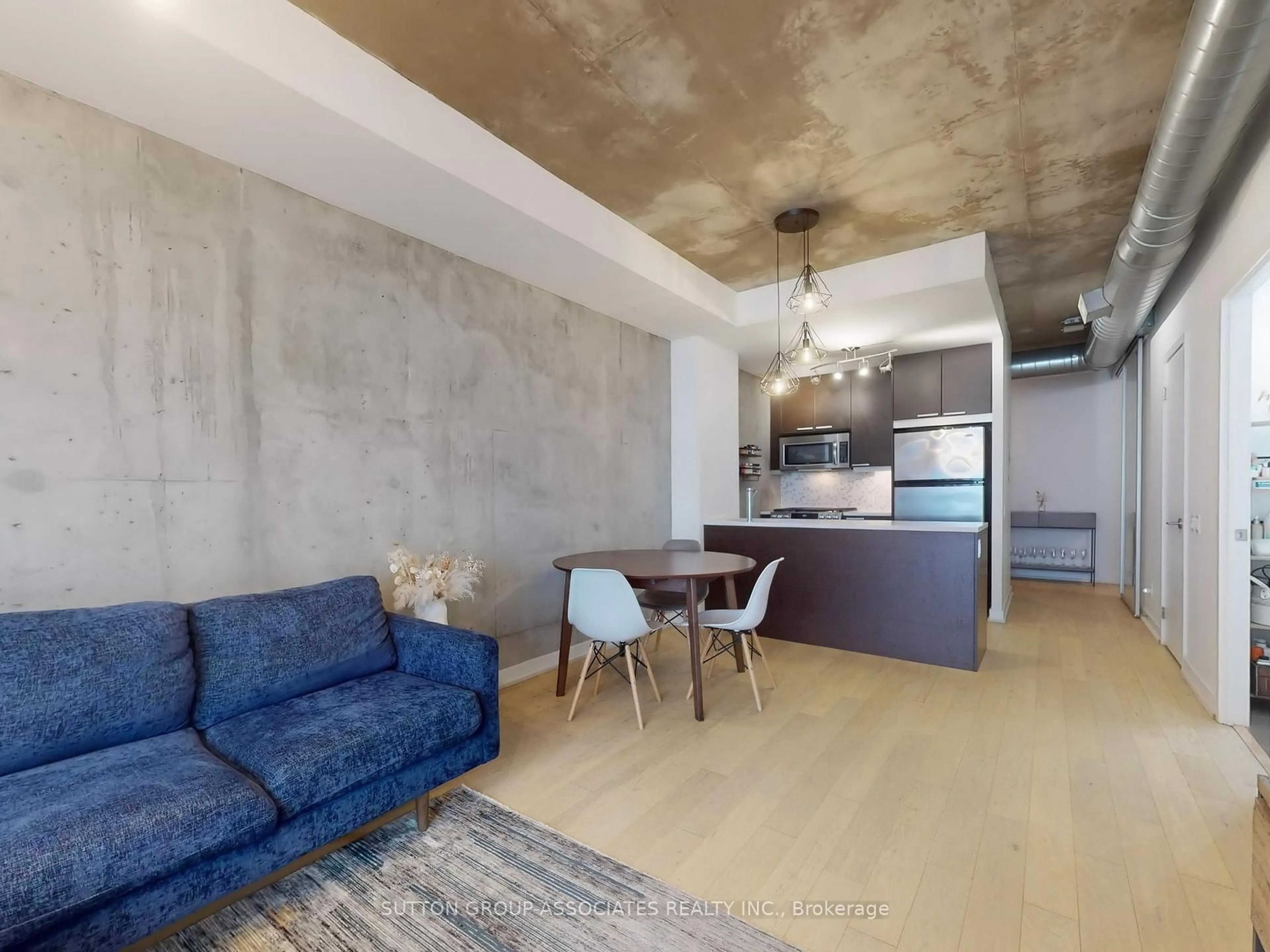Living room with furniture, cement floor for 138 Princess St #811, Toronto Ontario M5A 0B1