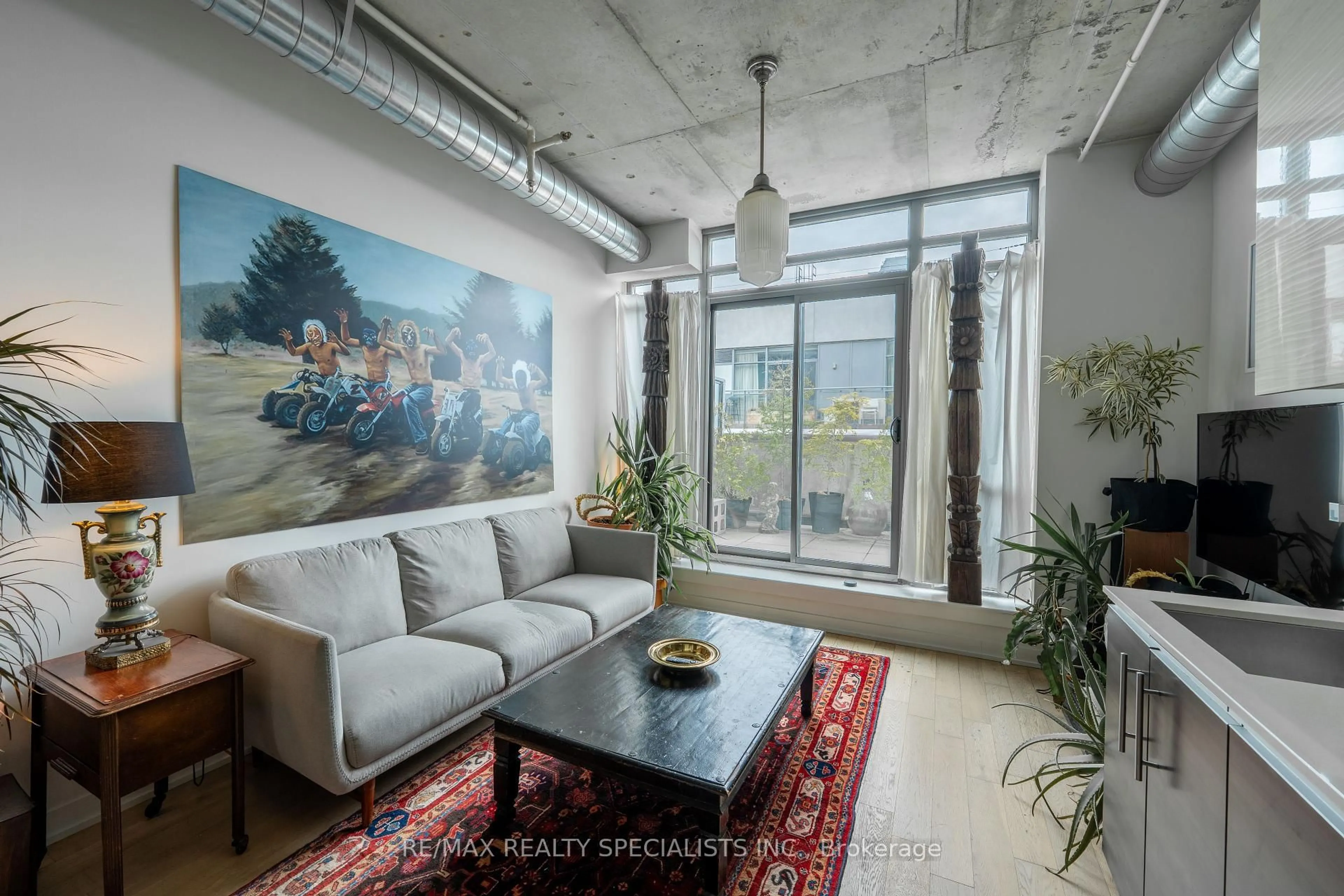 Living room with furniture, cement floor for 8 Gladstone Ave #PH 705, Toronto Ontario M6J 0B3