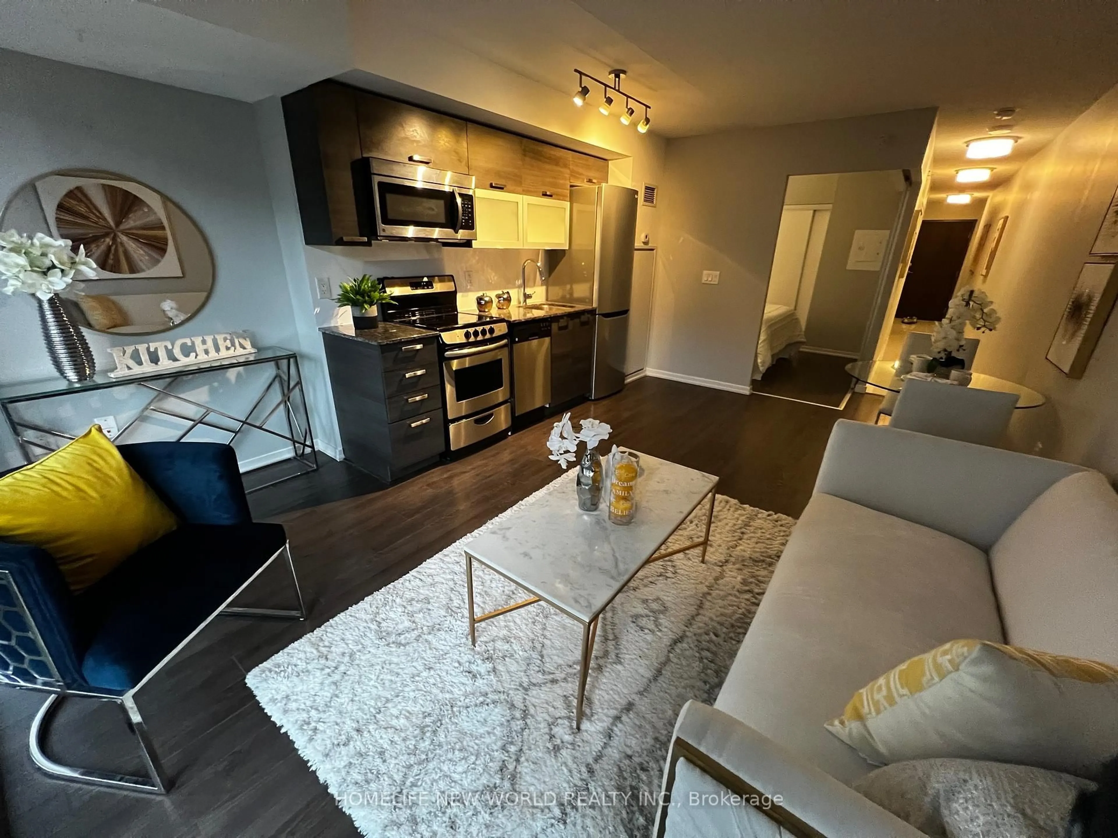 Open concept kitchen, wood/laminate floor for 36 Lisgar St #516E, Toronto Ontario M6J 3G2