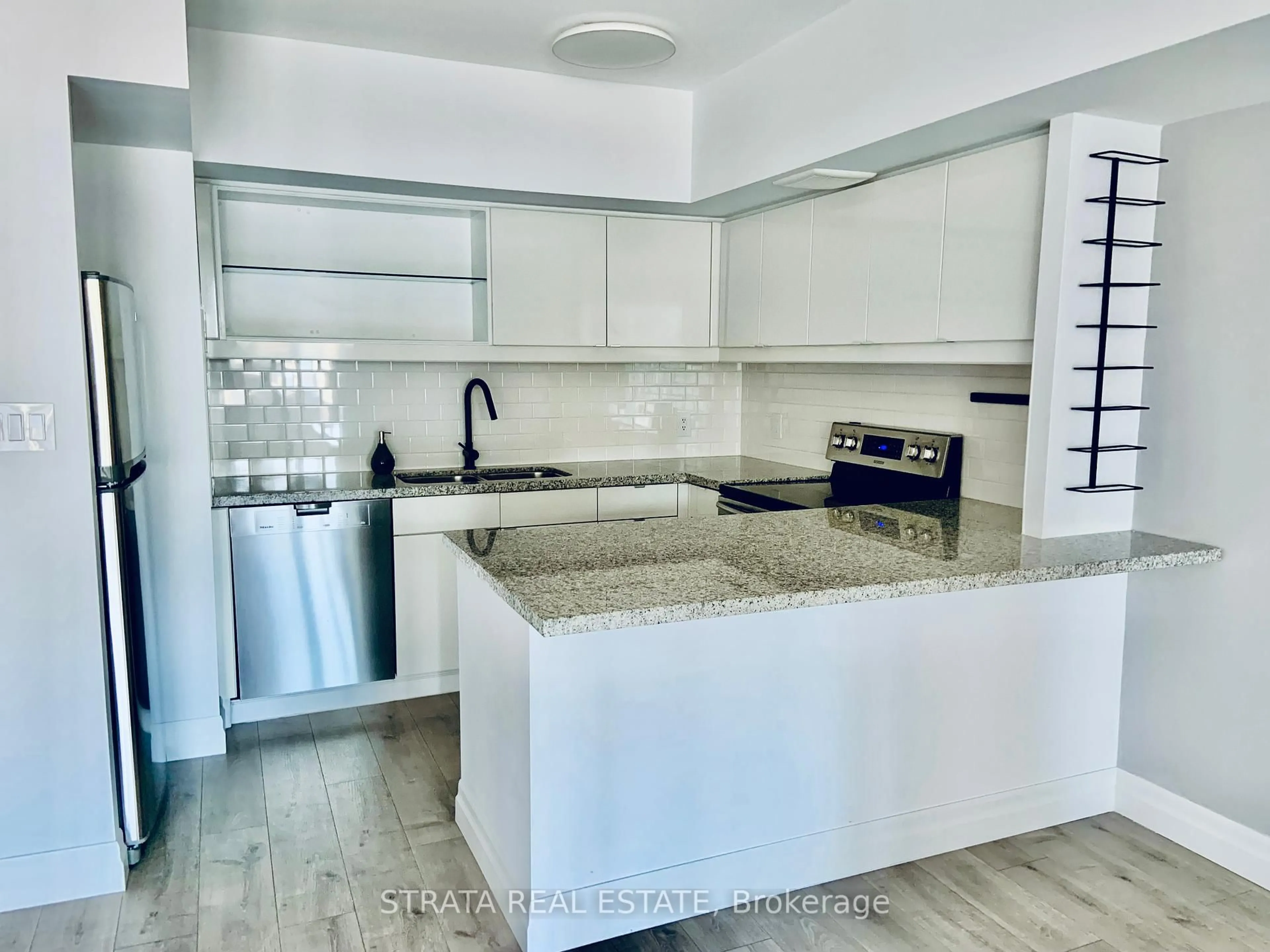 Open concept kitchen, ceramic/tile floor for 25 The Esplanade N/A #1701, Toronto Ontario M5E 1W5