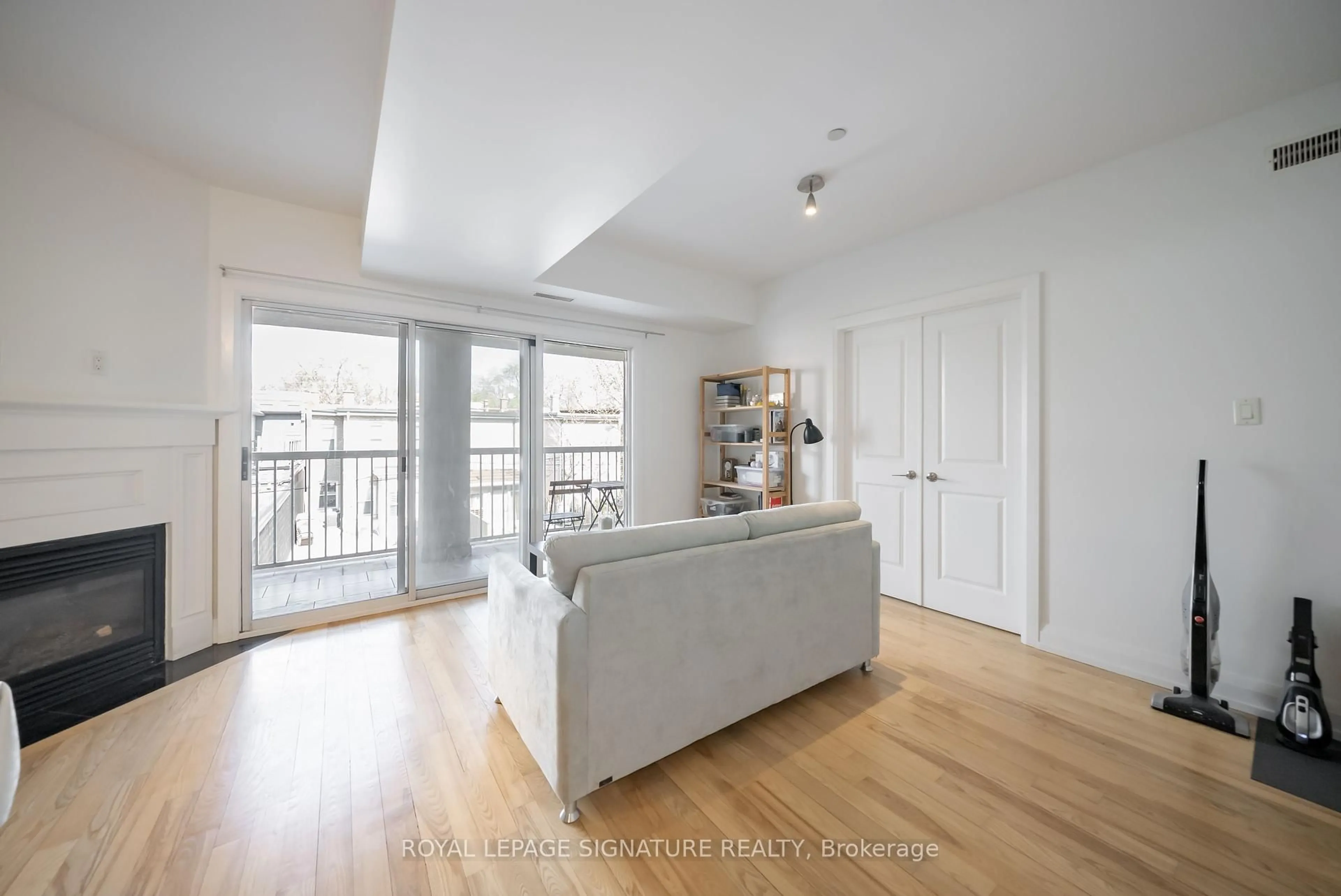 Living room with furniture, wood/laminate floor for 473 Dupont St #3, Toronto Ontario M6G 1Y6