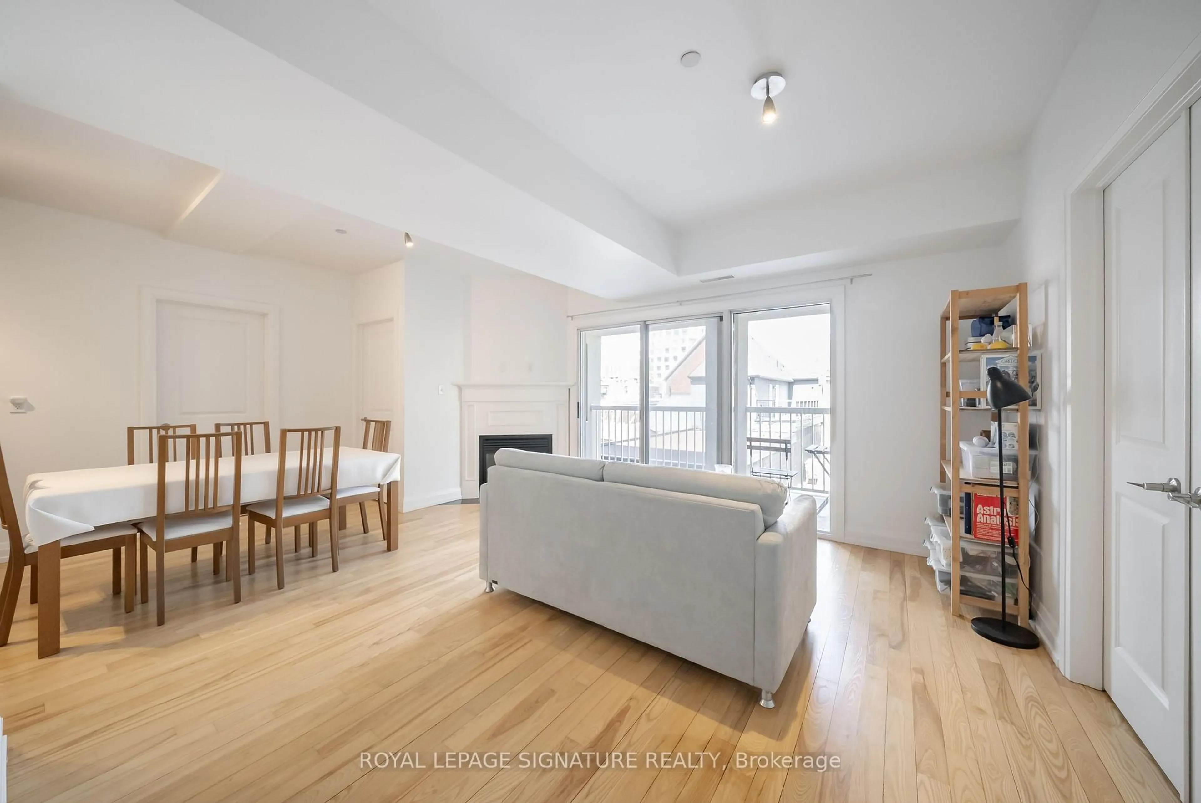 Living room with furniture, wood/laminate floor for 473 Dupont St #3, Toronto Ontario M6G 1Y6