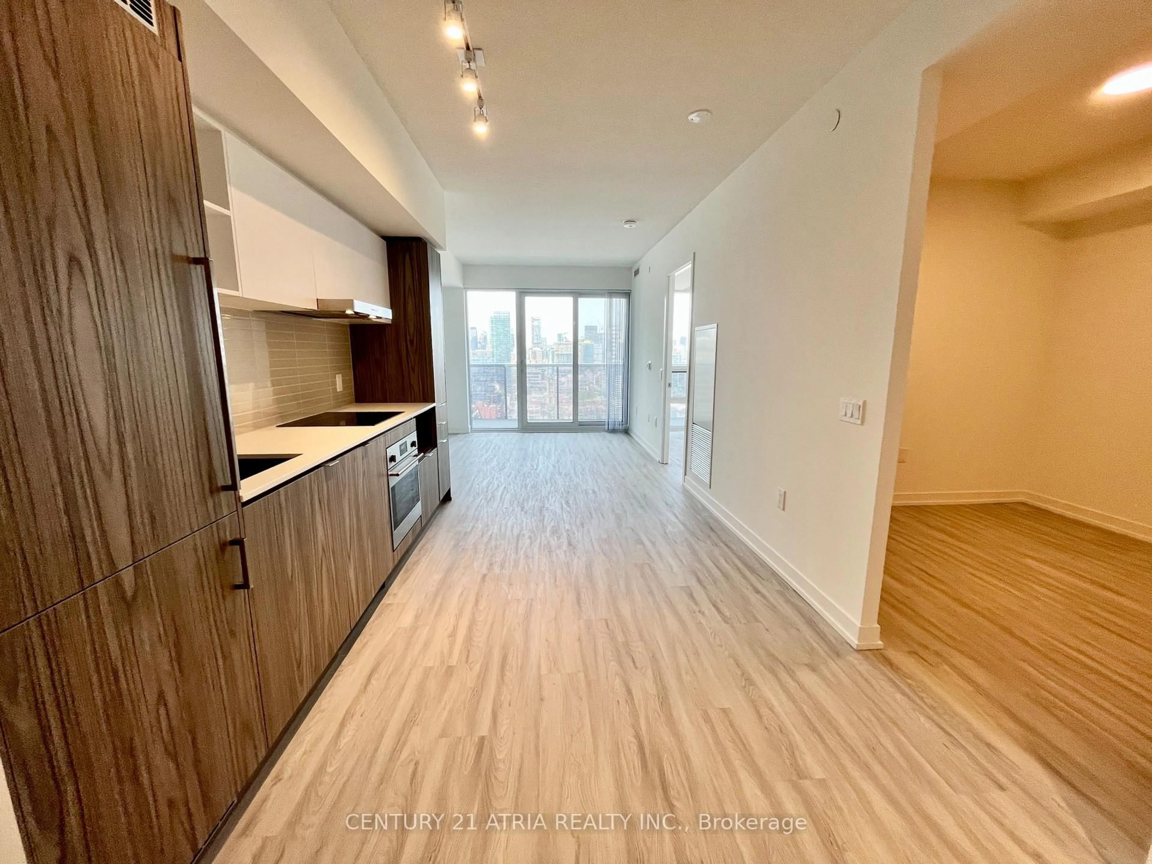 Open concept kitchen, wood/laminate floor for 55 Cooper St #3102, Toronto Ontario M5E 0G1