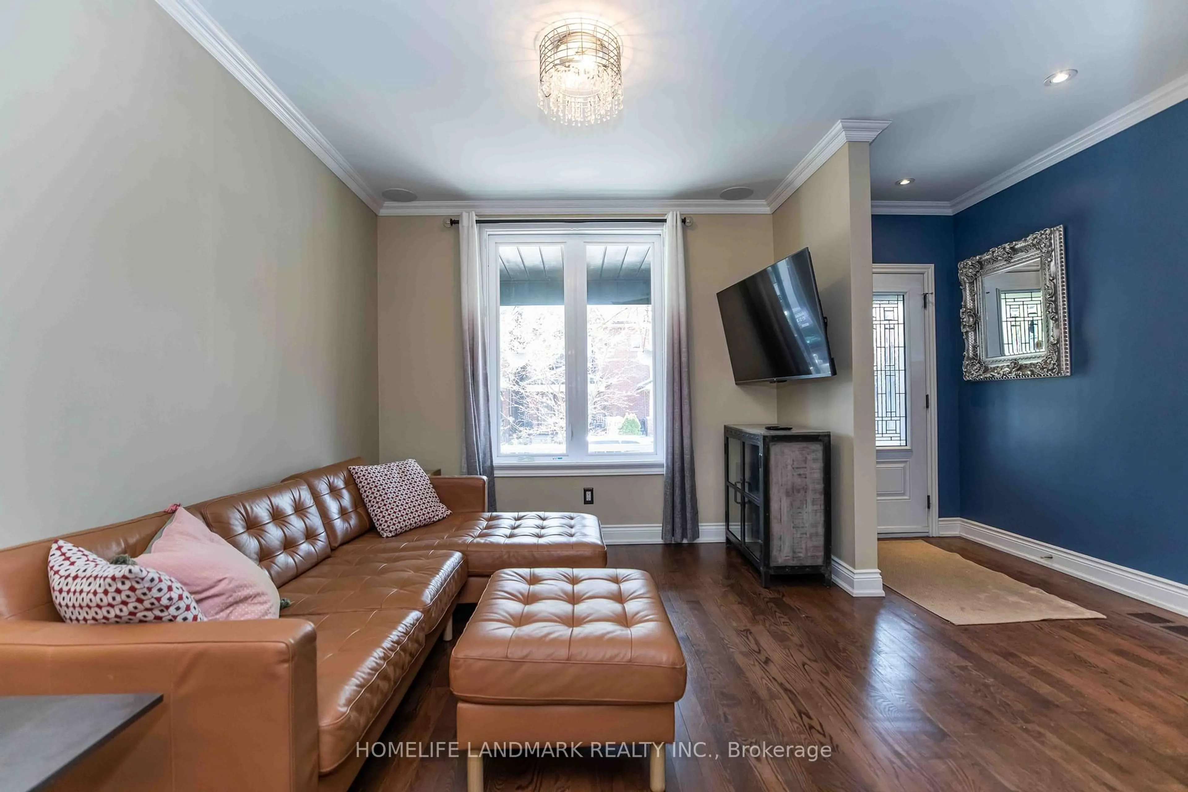 Living room with furniture, wood/laminate floor for 681 Manning Ave, Toronto Ontario M6G 2W3