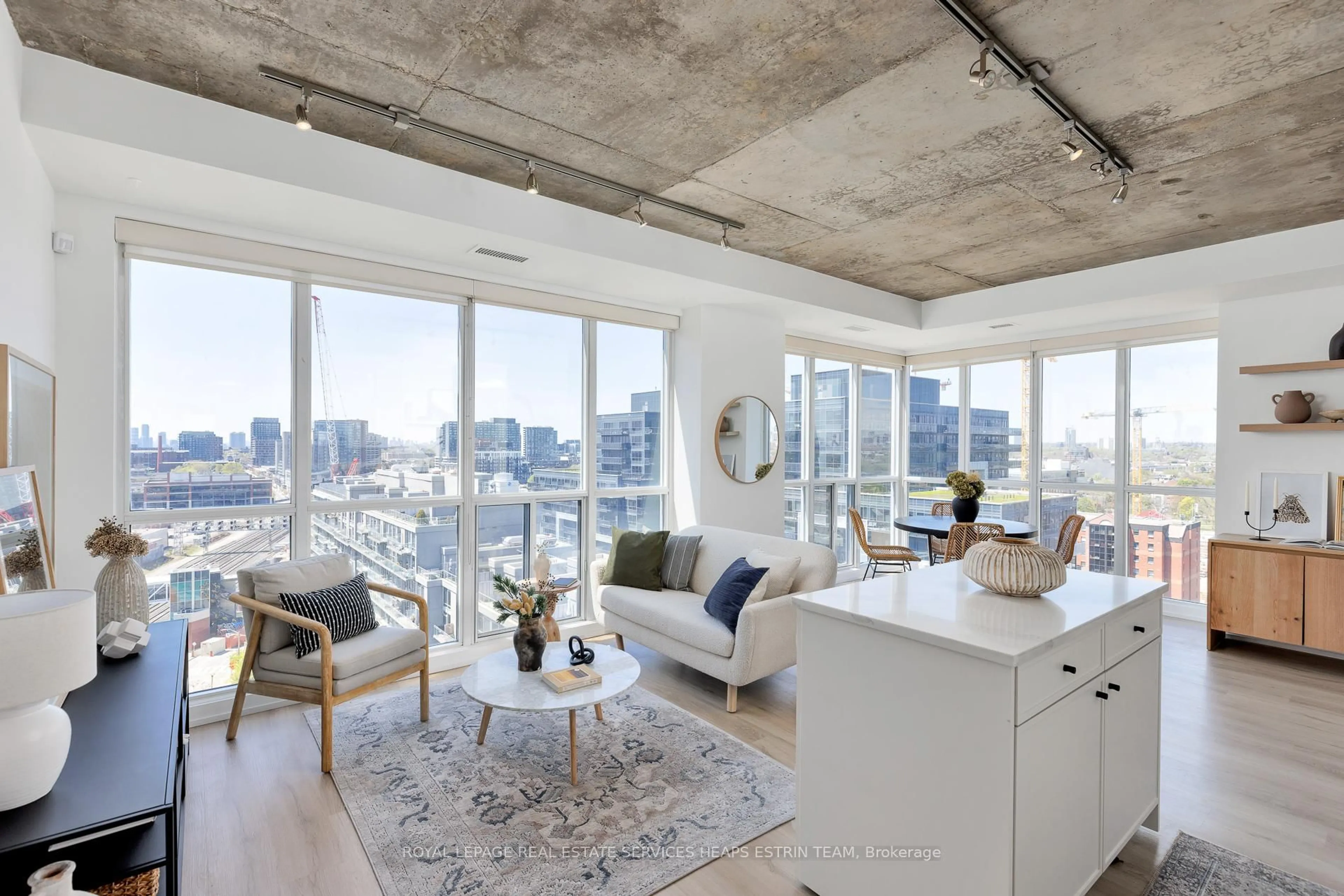 Living room with furniture, cement floor for 1 Shaw St #LPH26, Toronto Ontario M6K 0A1