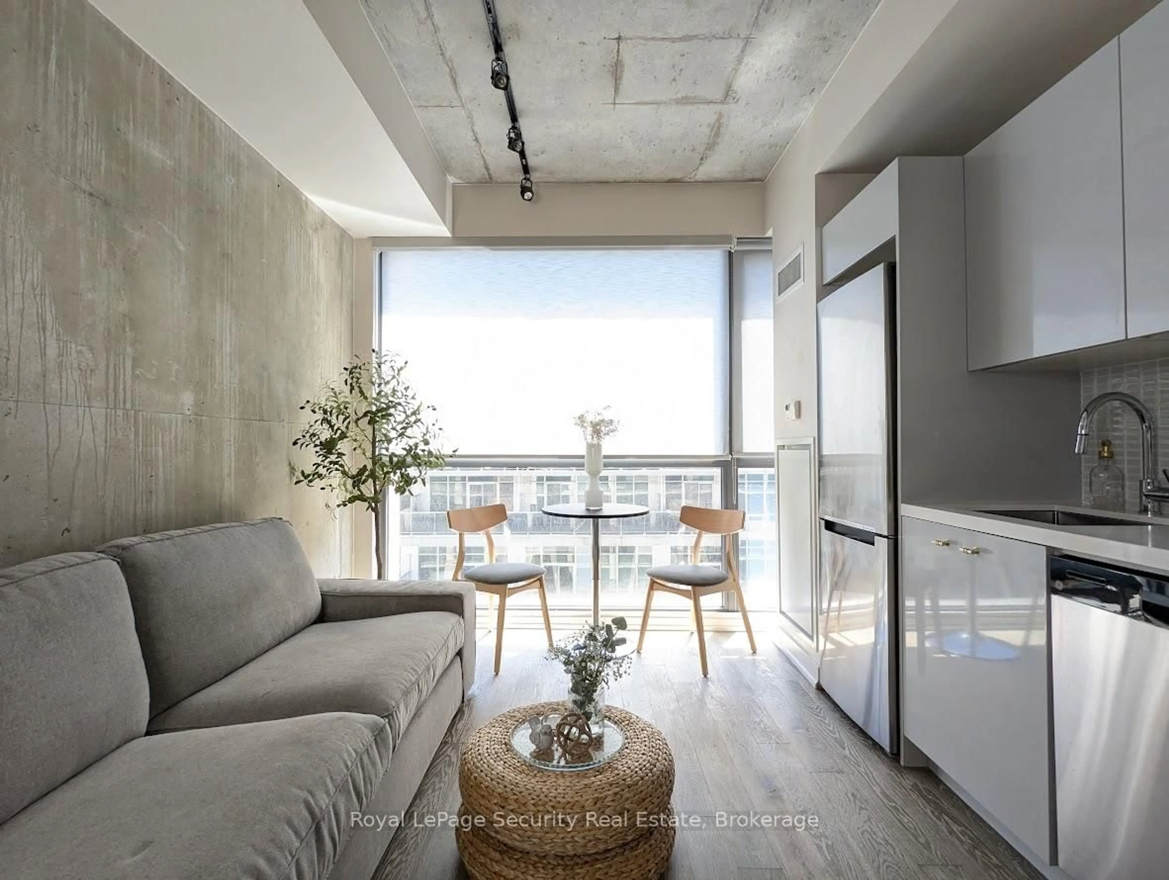 Living room with furniture, cement floor for 39 Brant St #816, Toronto Ontario M5V 0M8