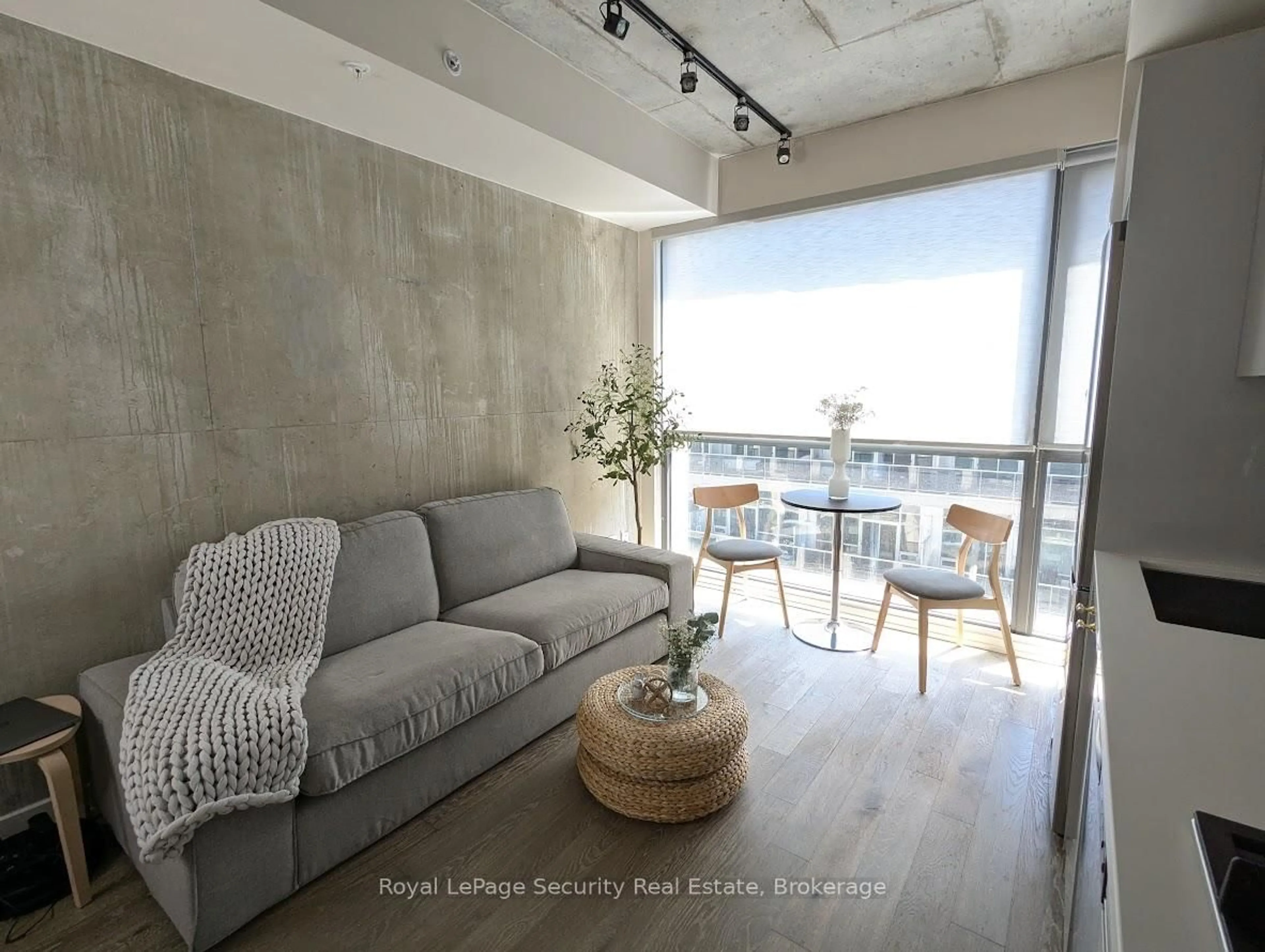 Living room with furniture, cement floor for 39 Brant St #816, Toronto Ontario M5V 0M8