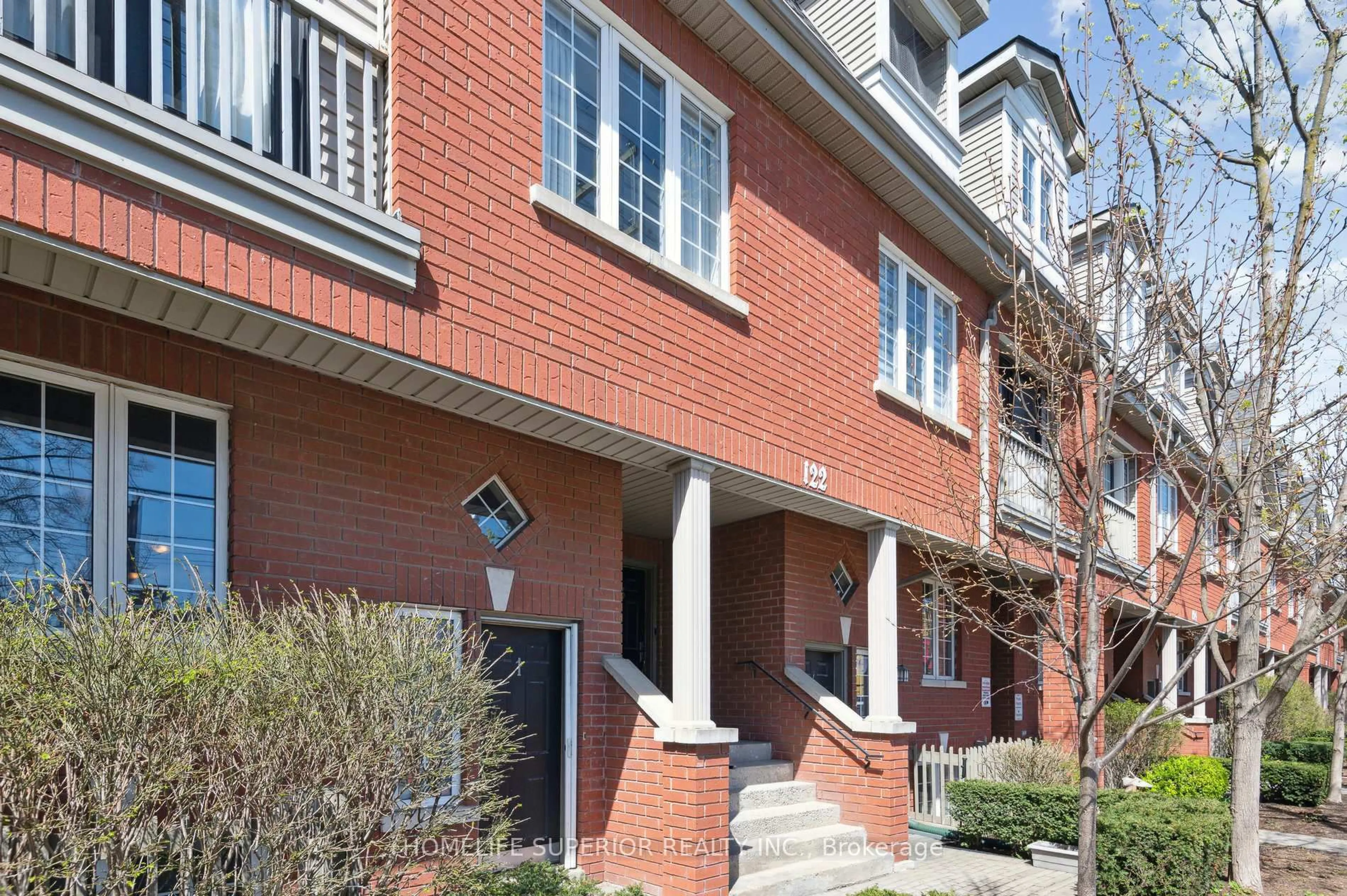 Home with brick exterior material, street for 122 Strachan Ave #1, Toronto Ontario M6J 3W4