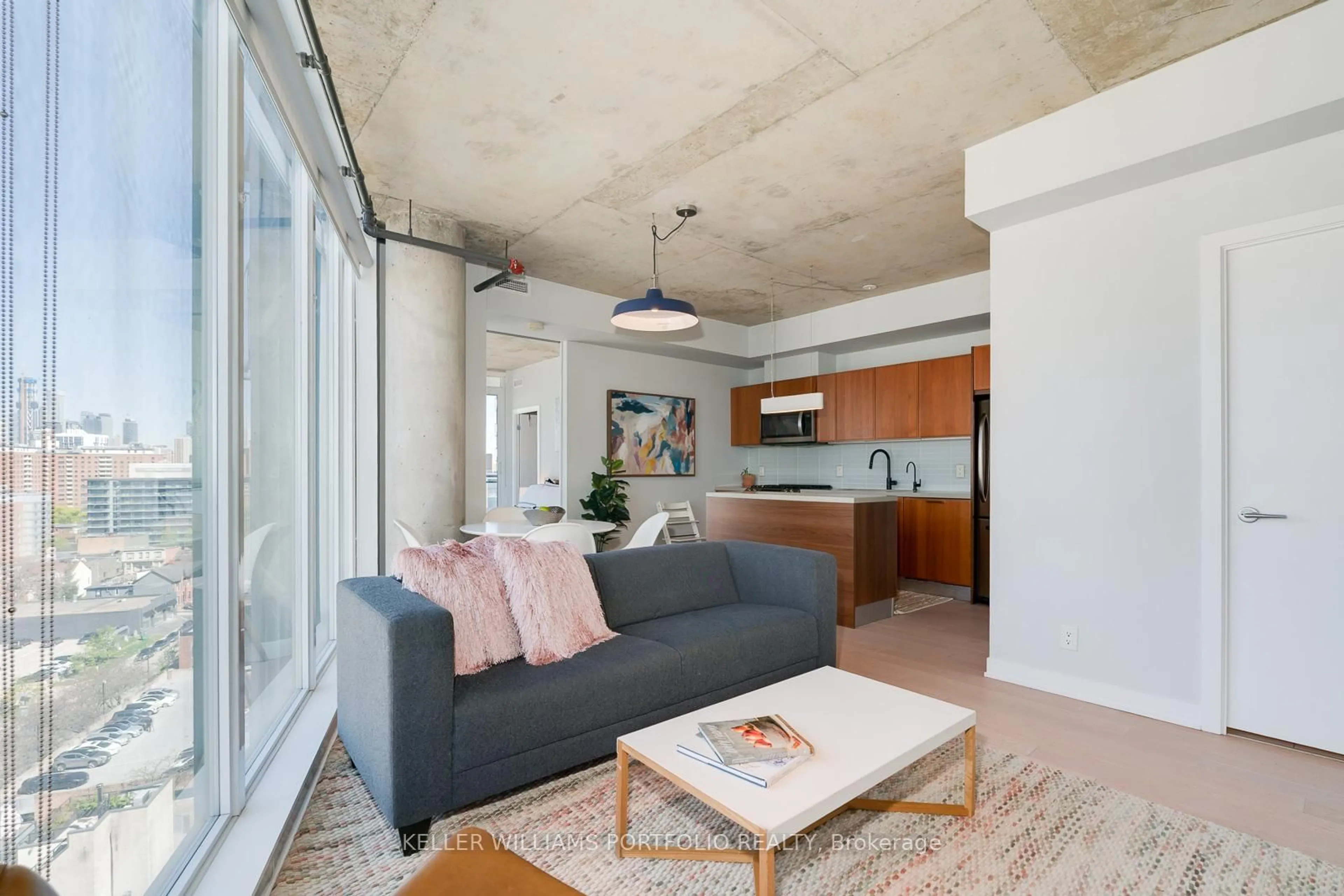 Living room with furniture, cement floor for 318 King St #1212, Toronto Ontario M5A 0C1