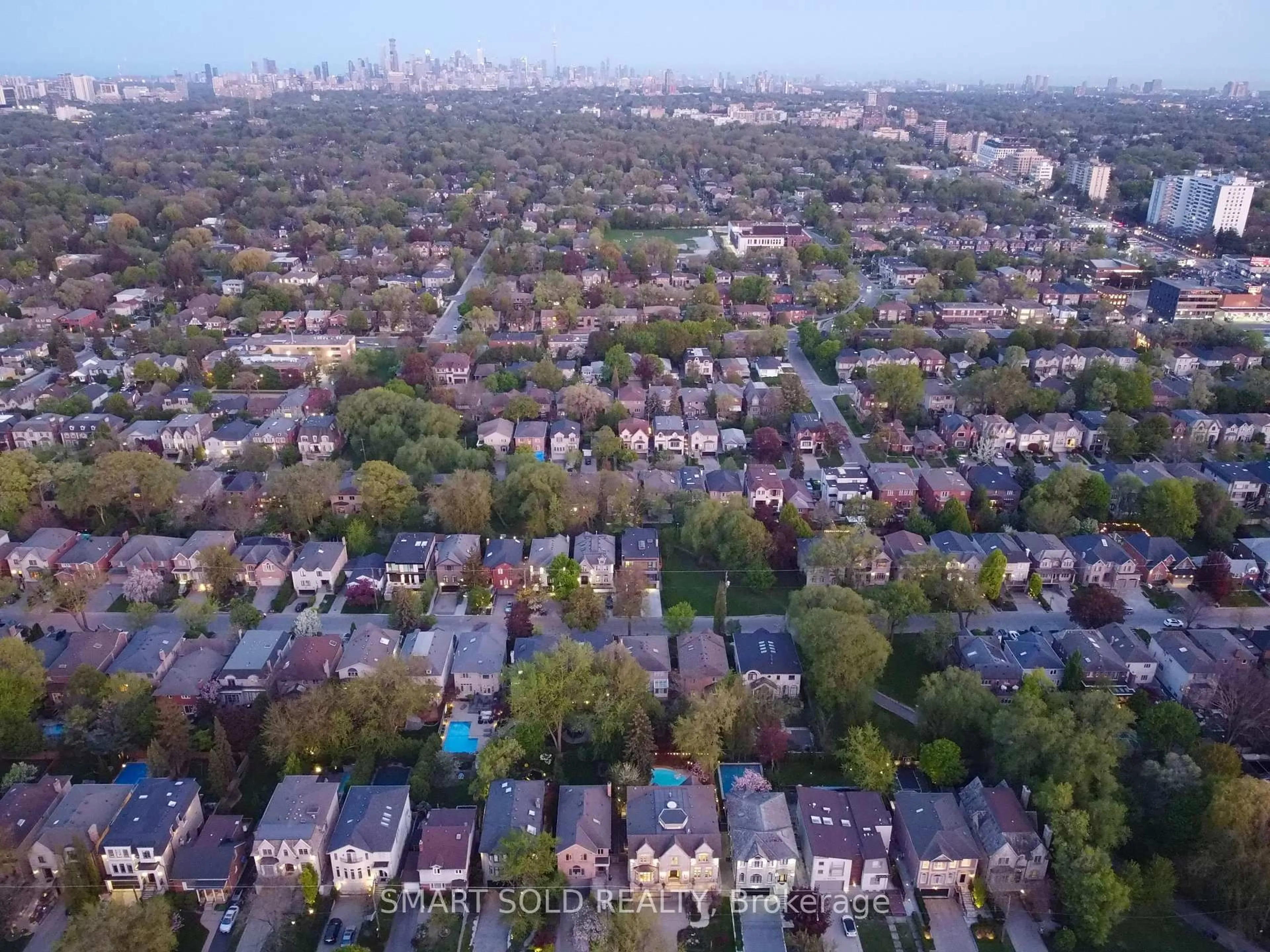 A pic from outside/outdoor area/front of a property/back of a property/a pic from drone, city buildings view from balcony for 677 Woburn Ave, Toronto Ontario M5M 1M2