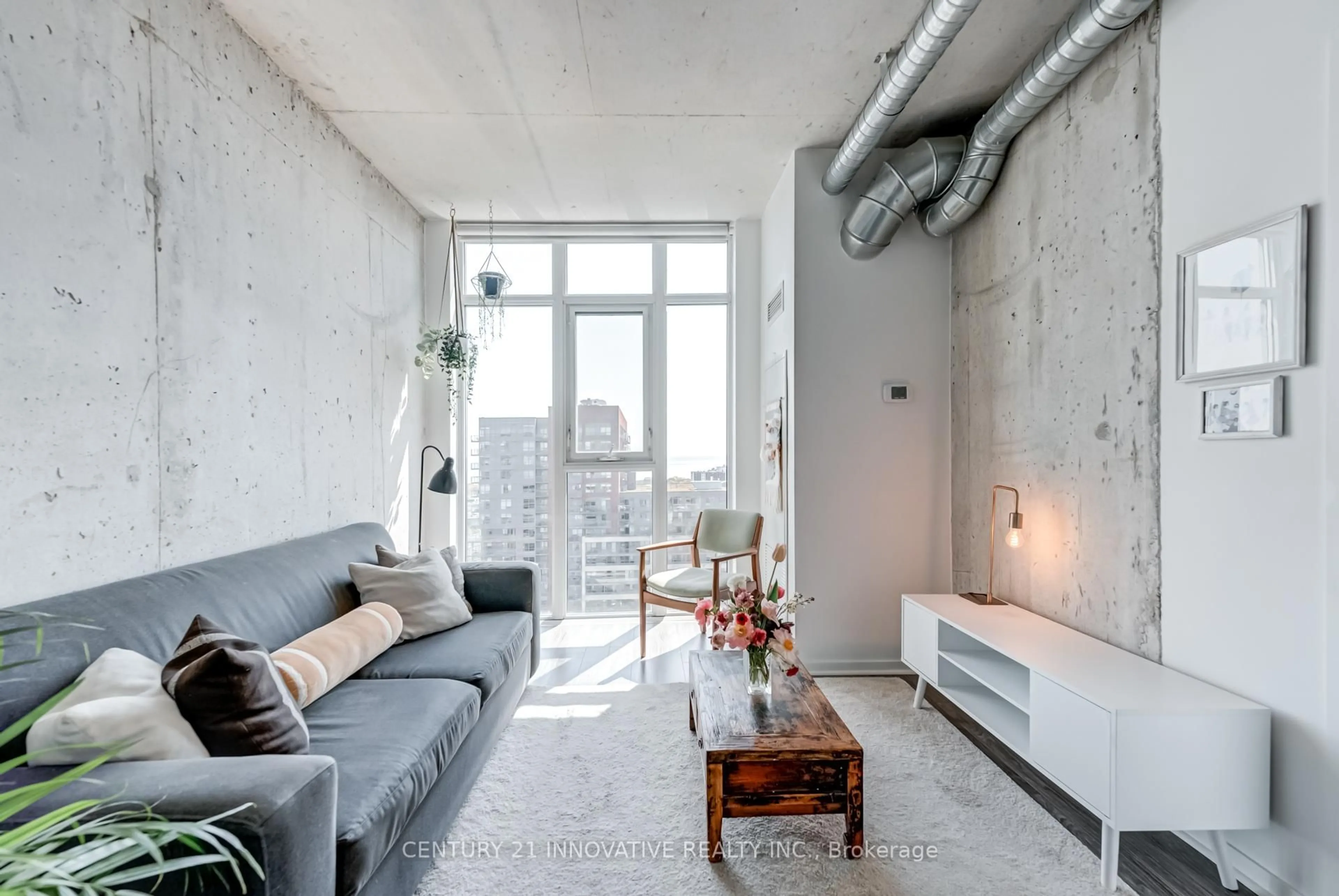 Living room with furniture, cement floor for 150 Sudbury St #1916, Toronto Ontario M6J 3S8