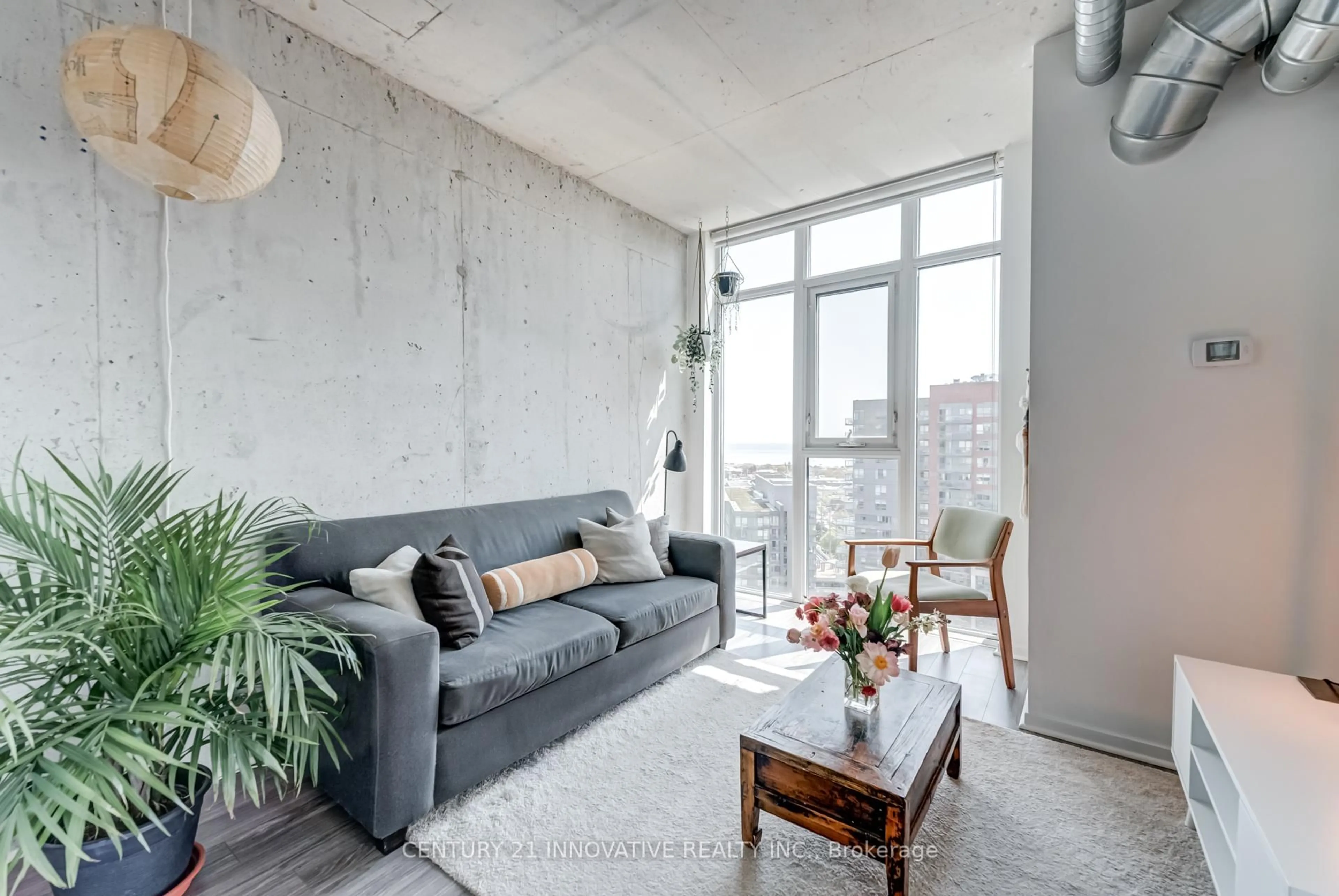 Living room with furniture, cement floor for 150 Sudbury St #1916, Toronto Ontario M6J 3S8