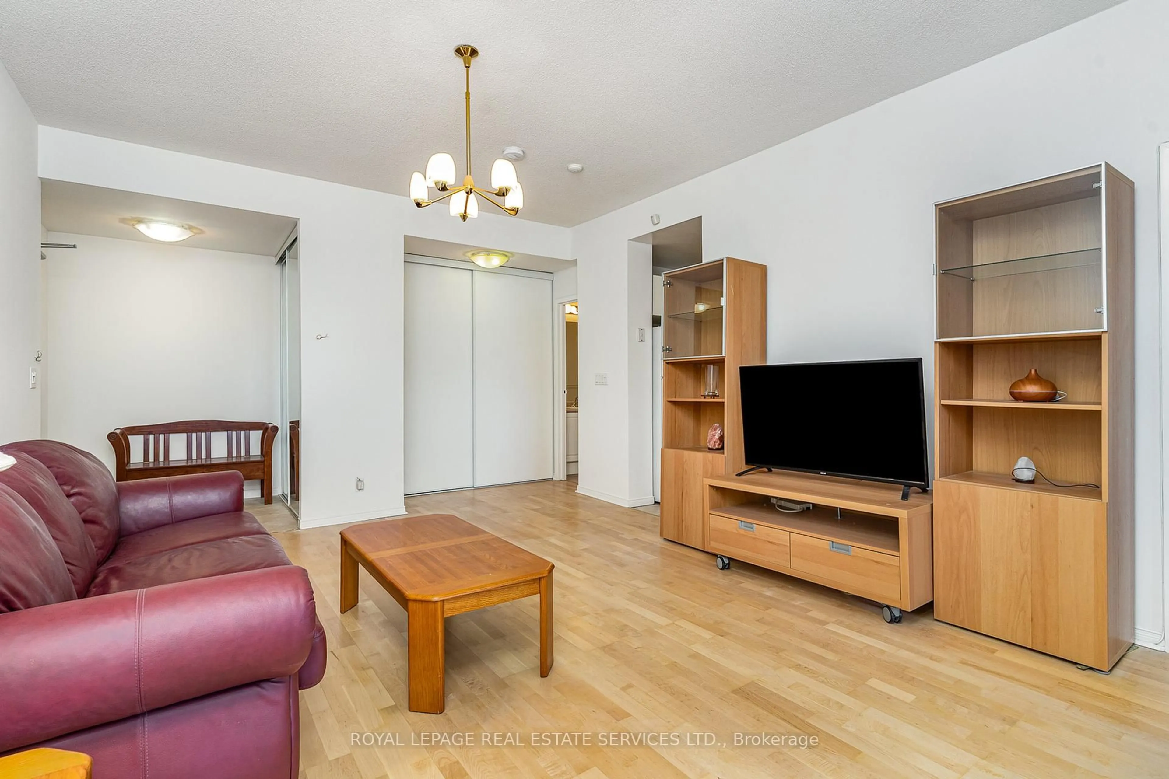 Living room with furniture, wood/laminate floor for 778 Sheppard Ave #303, Toronto Ontario M3H 6B7