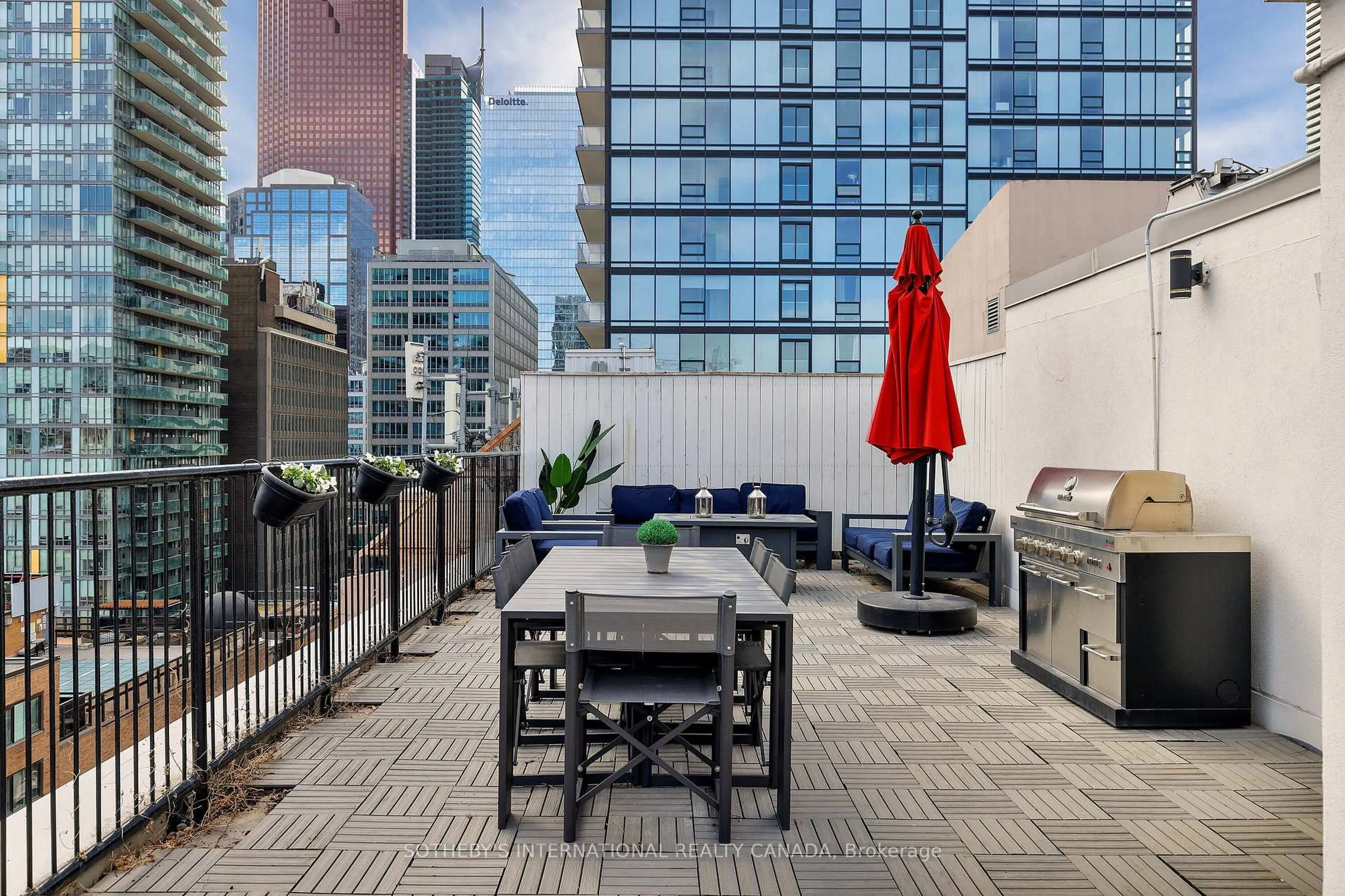 Patio, city buildings view from balcony for 82 Lombard St #PH 912, Toronto Ontario M5C 2S8