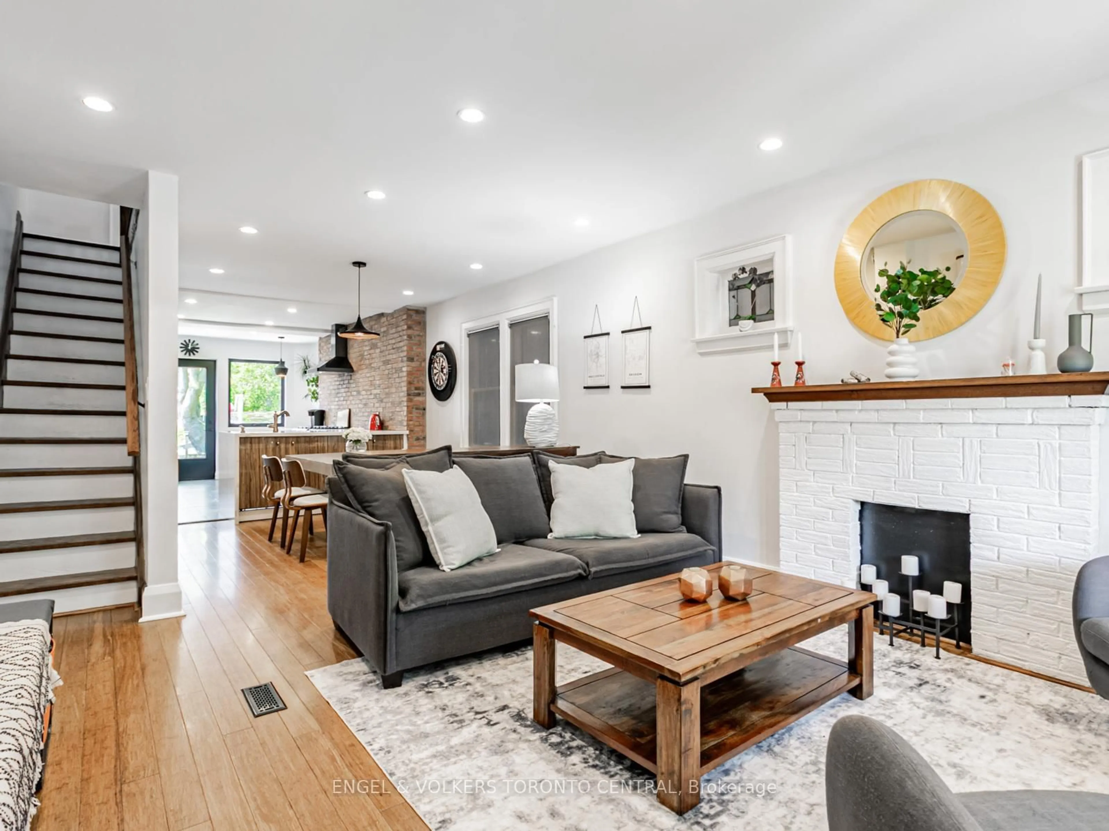 Living room with furniture, wood/laminate floor for 54 Winona Dr, Toronto Ontario M6G 3S6