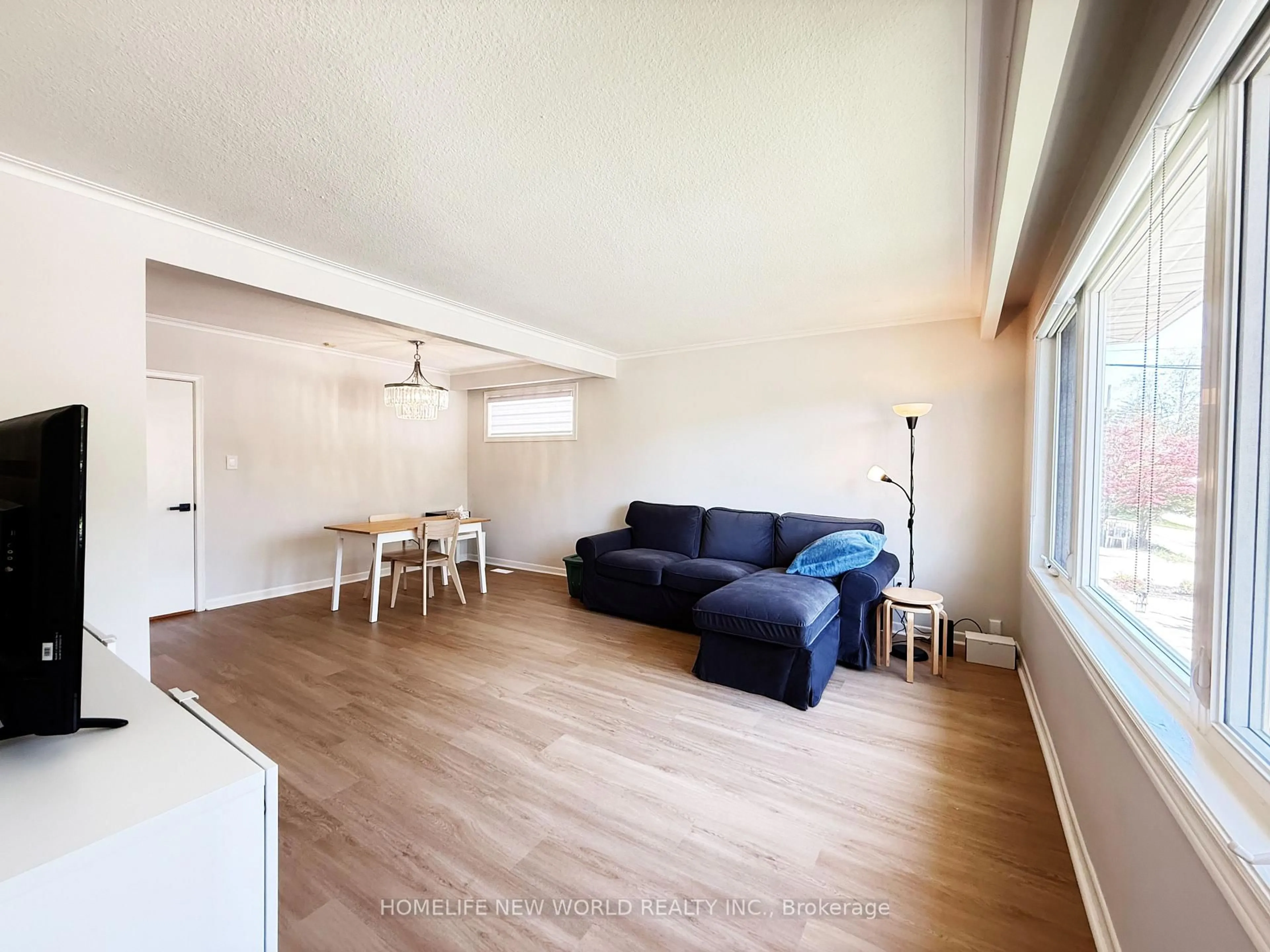 Living room with furniture, wood/laminate floor for 98 Newton Dr, Toronto Ontario M2M 2N1