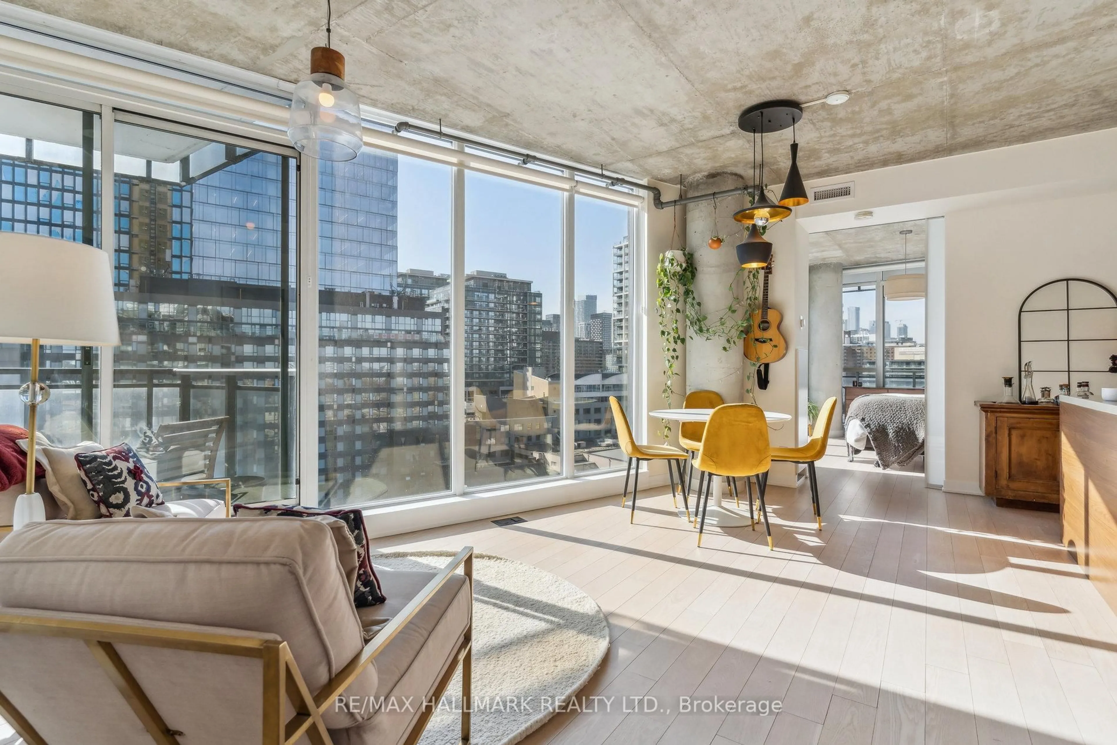 Living room with furniture, cement floor for 318 King St #1014, Toronto Ontario M5A 0C1