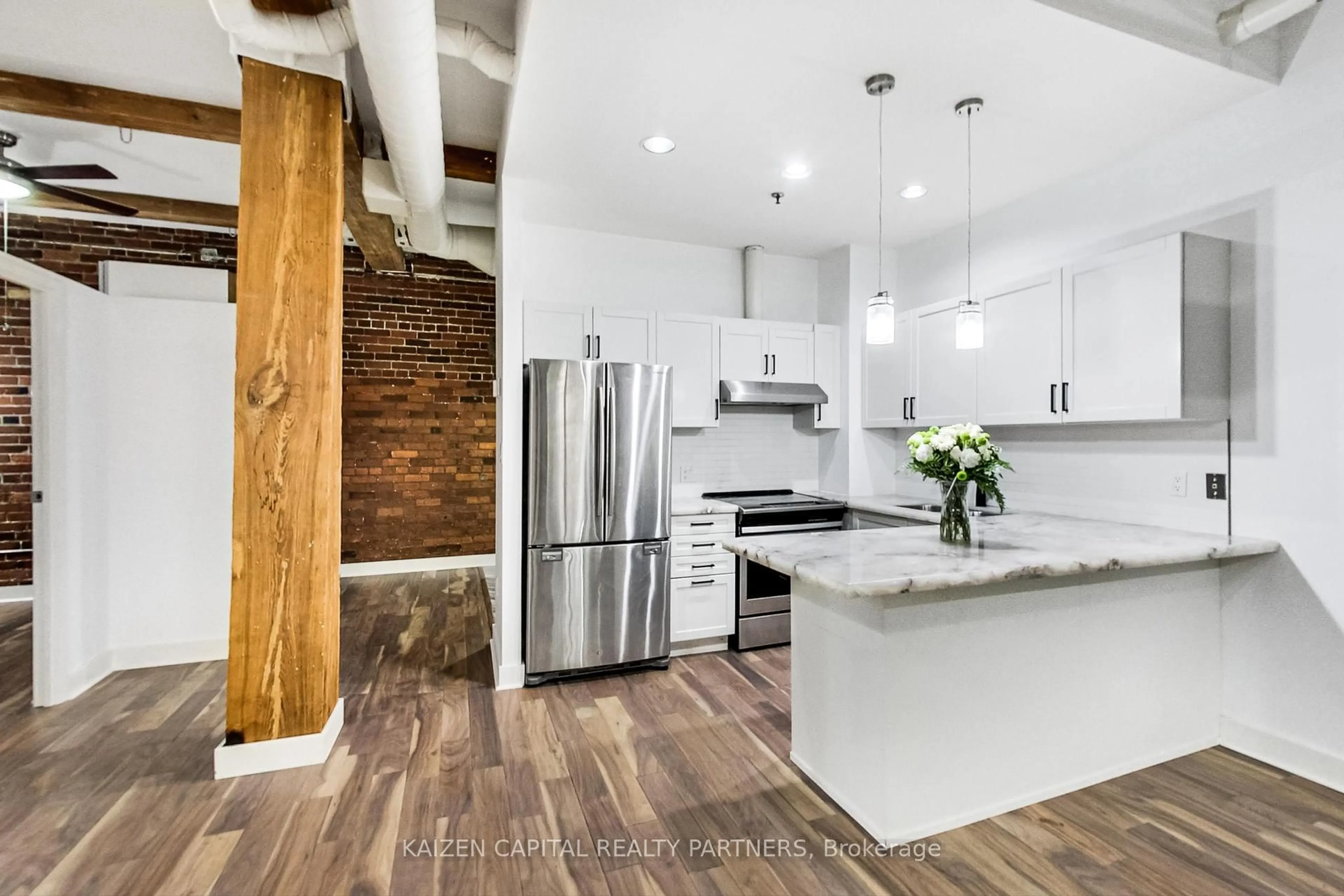 Open concept kitchen, wood/laminate floor for 90 Sherbourne St #103, Toronto Ontario M5A 2R1