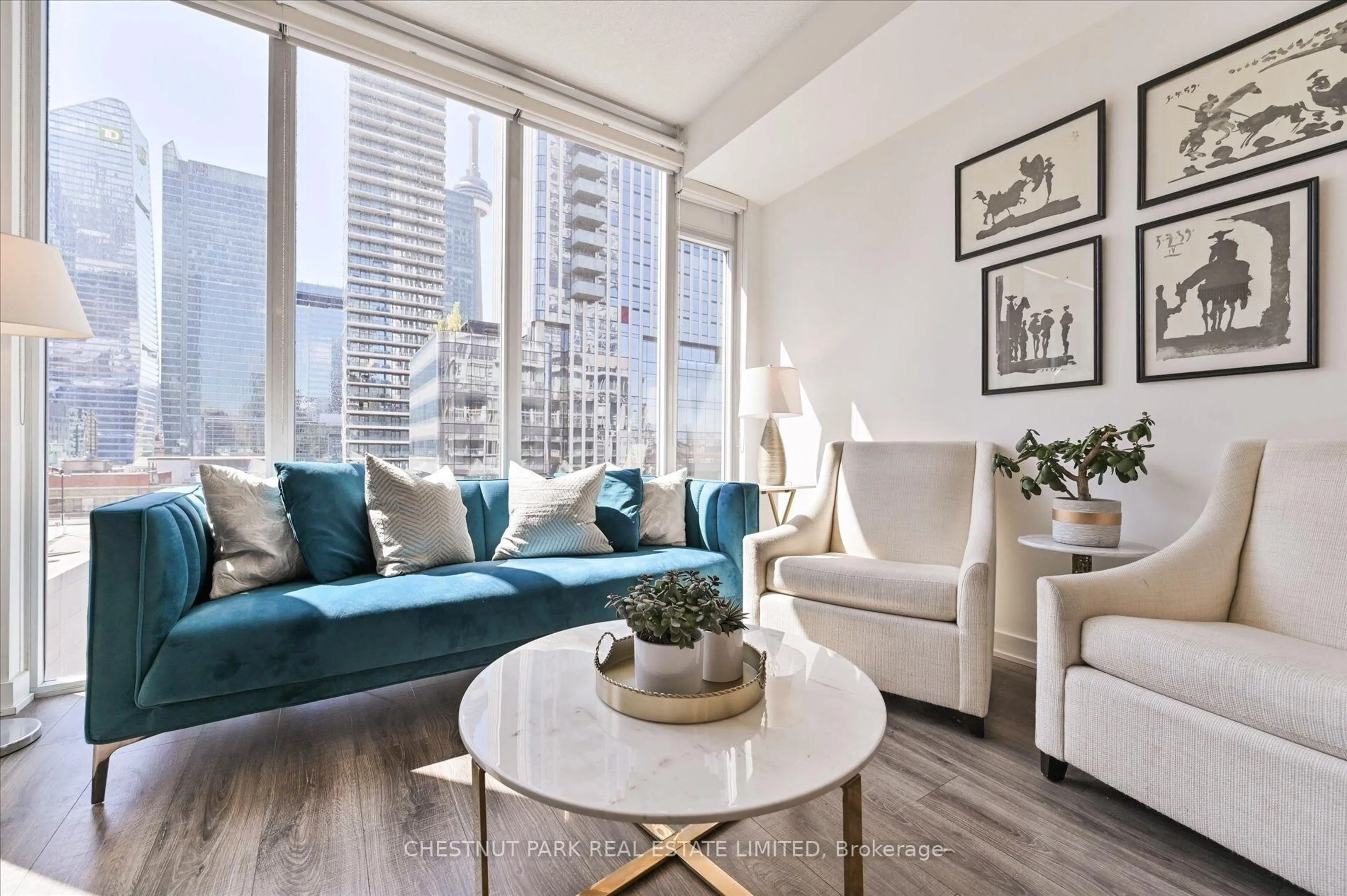 Living room with furniture, wood/laminate floor for 21 Nelson St #1020, Toronto Ontario M5V 3H9