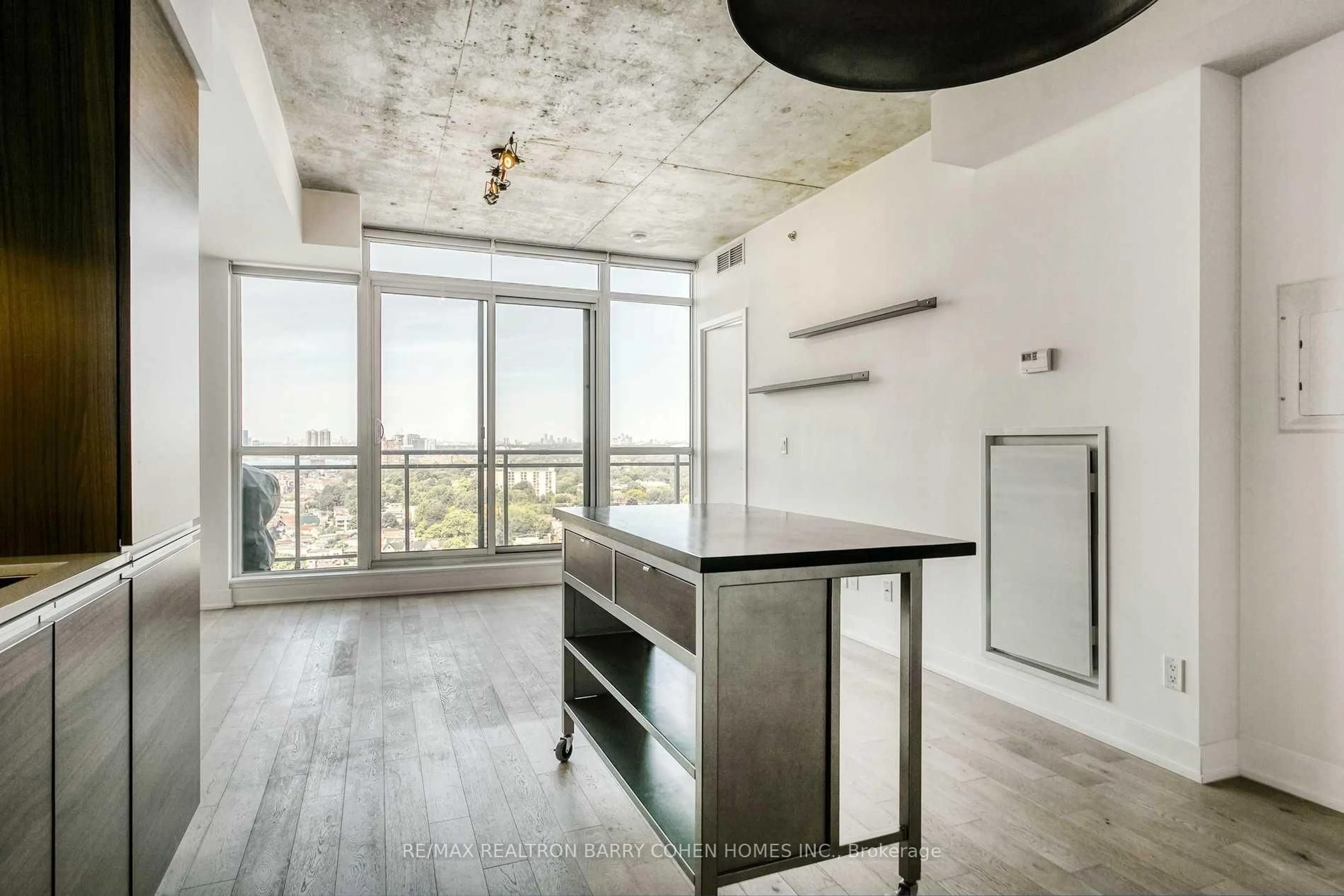 Open concept kitchen, cement floor for 20 Minowan Miikan Lane #2011, Toronto Ontario M6J 0E5