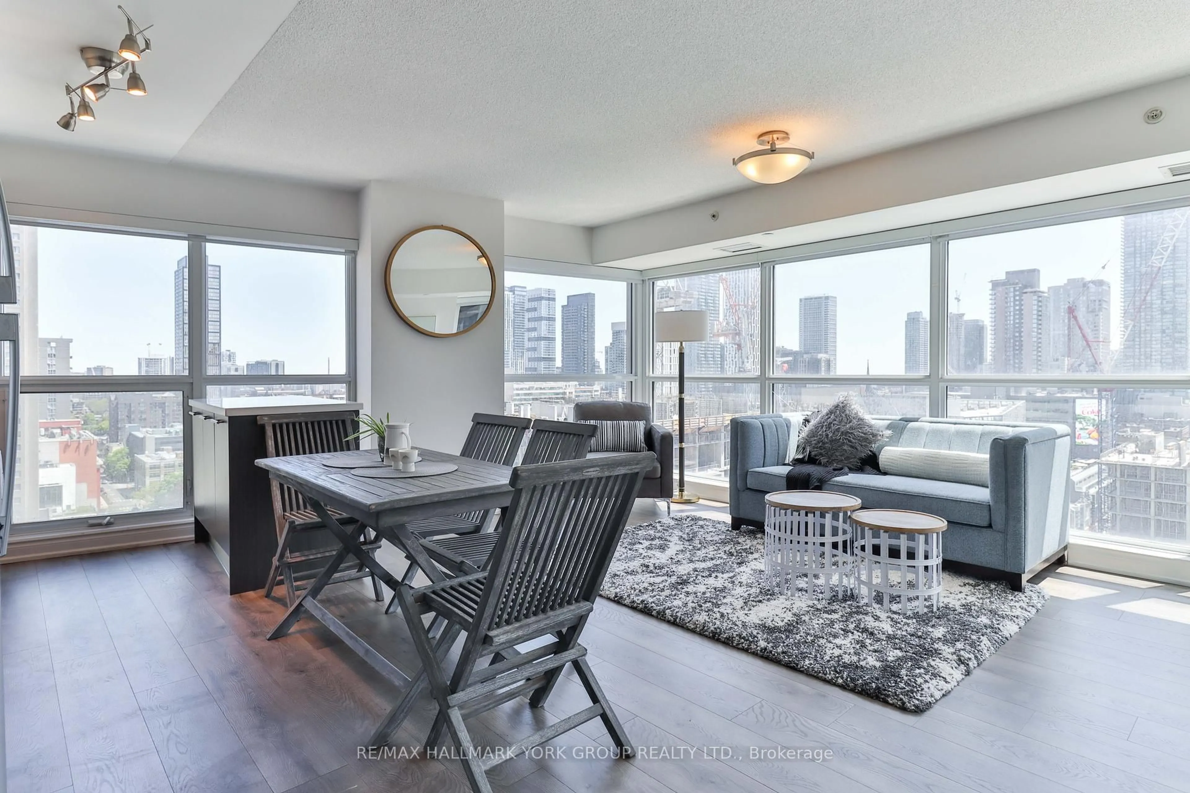 Living room with furniture, wood/laminate floor for 386 Yonge St #1607, Toronto Ontario M5B 0A5