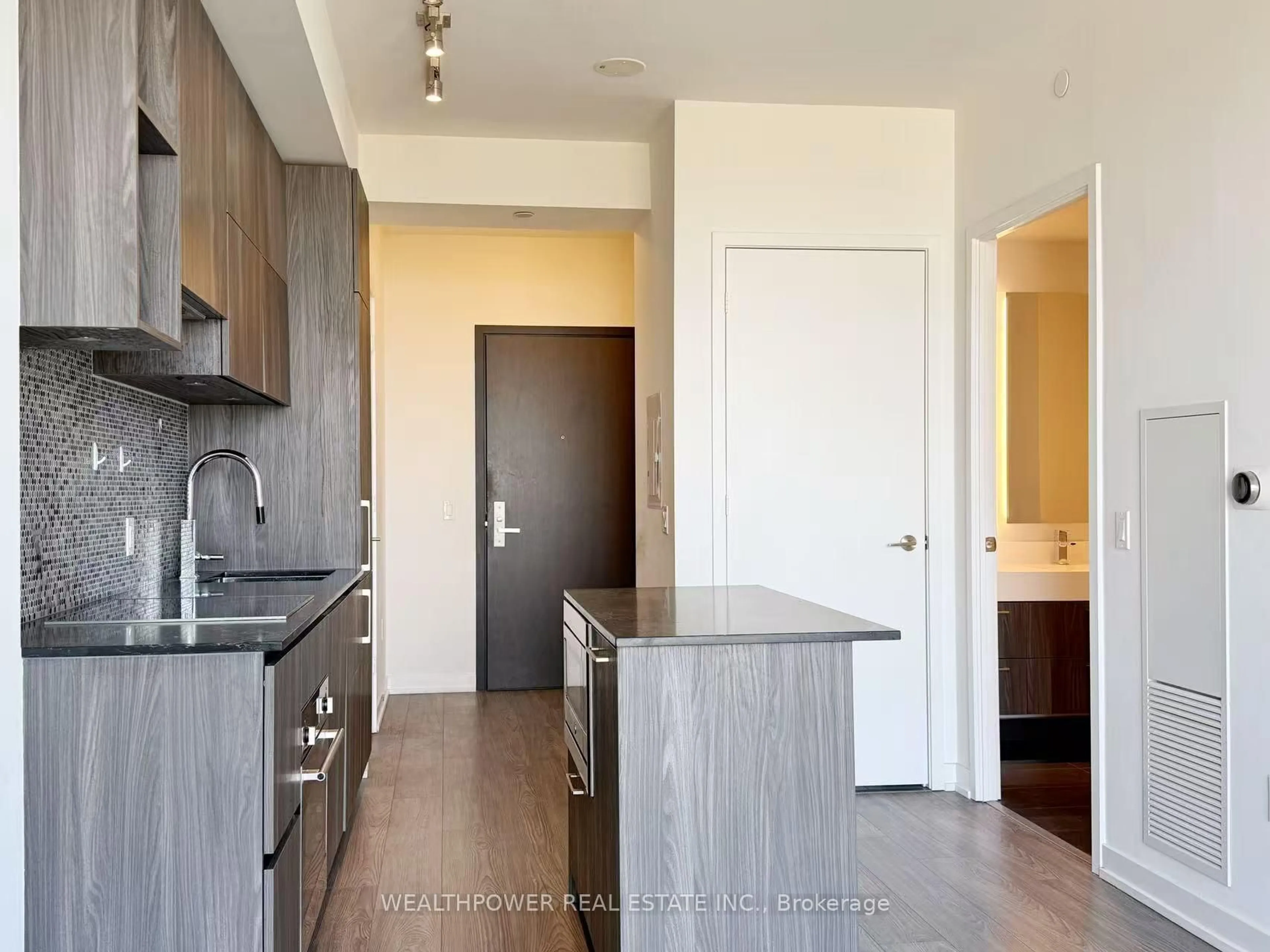 Open concept kitchen, wood/laminate floor for 1 Yorkville Ave #3910, Toronto Ontario M4W 1L1
