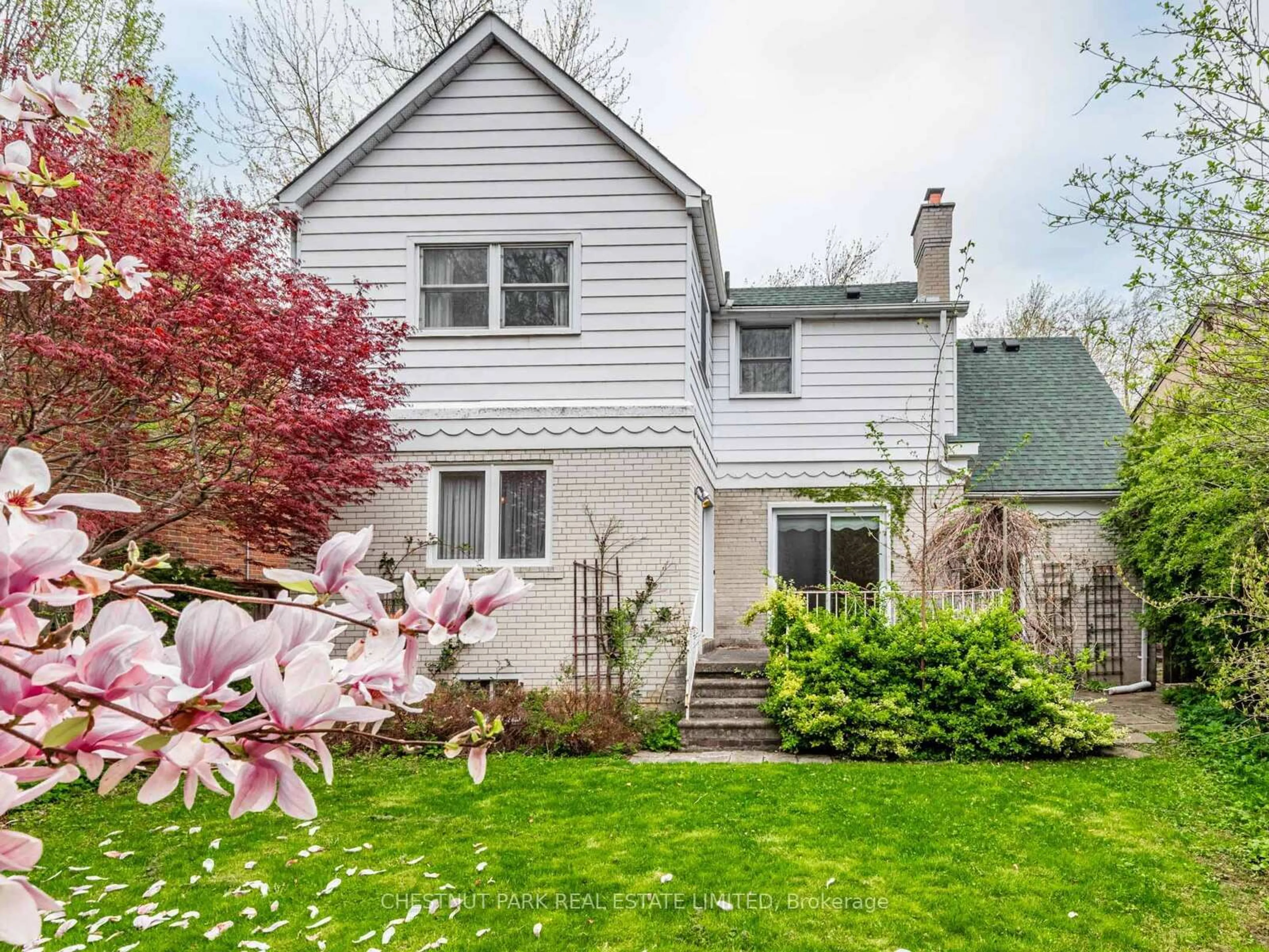 Home with vinyl exterior material, street for 53 Caribou Rd, Toronto Ontario M5N 2A6
