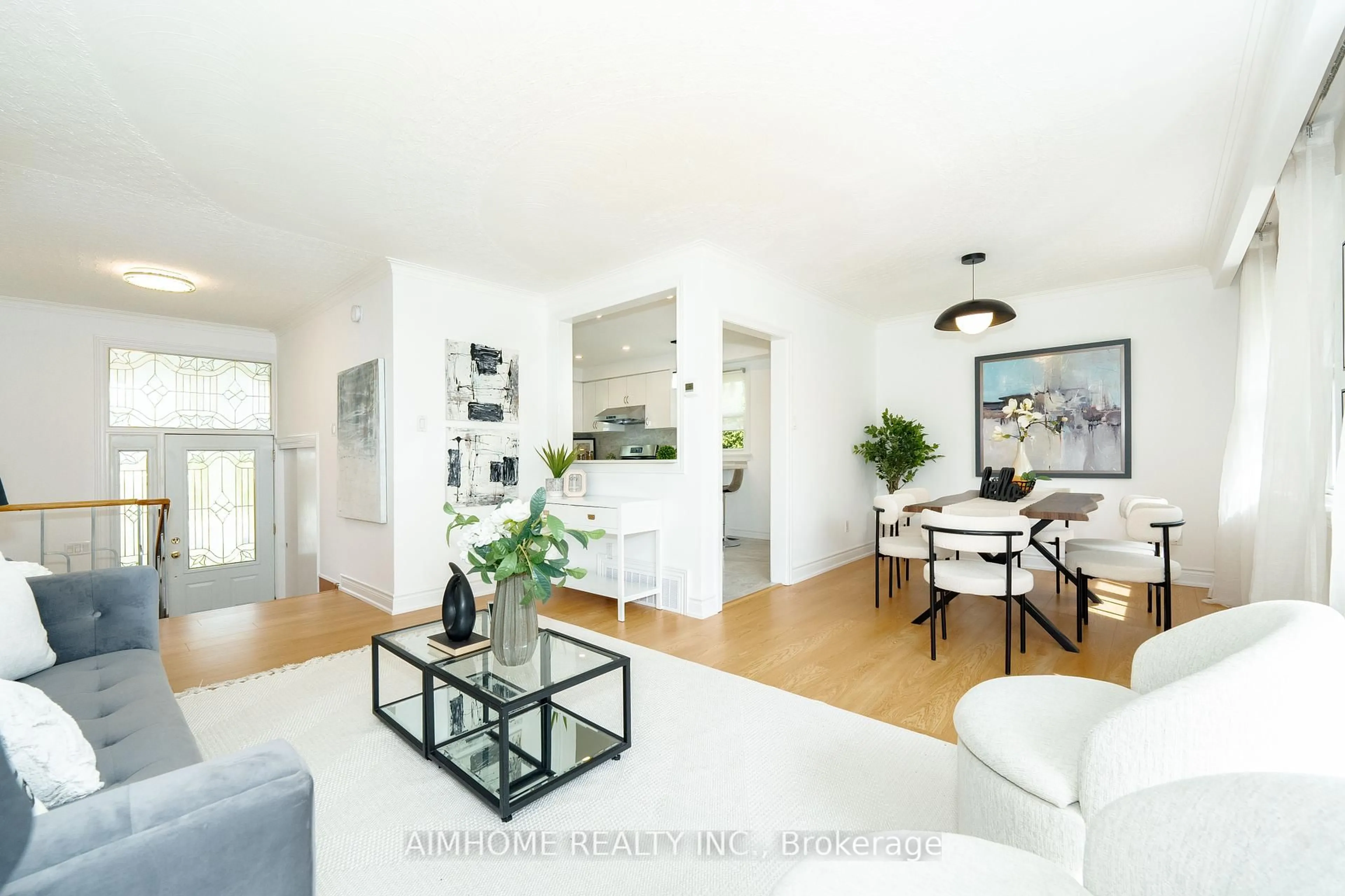 Living room with furniture, wood/laminate floor for 145 Sloane Ave, Toronto Ontario M4A 2B8