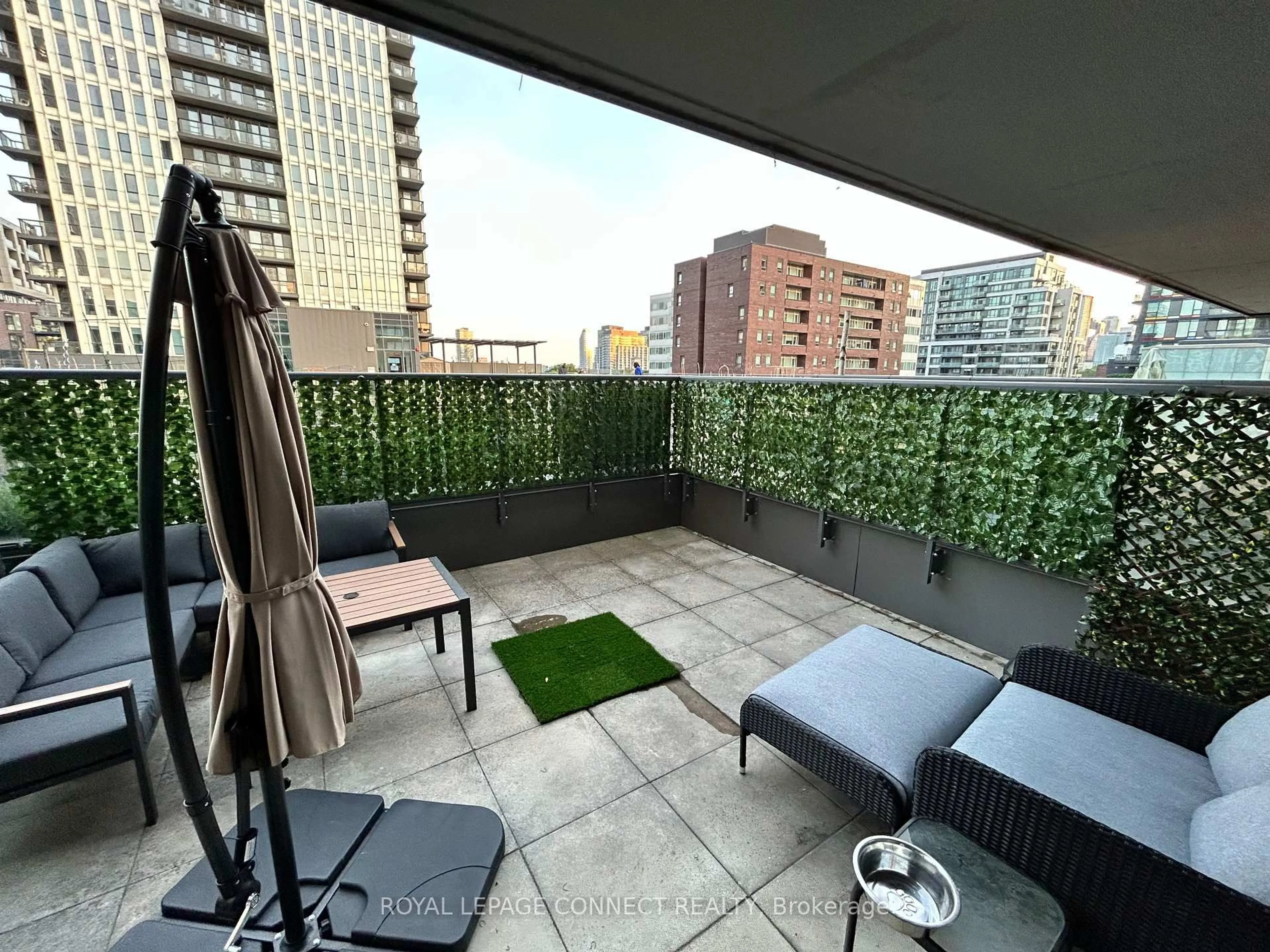 Patio, city buildings view from balcony for 170 Sumach St #518, Toronto Ontario M5A 0C3