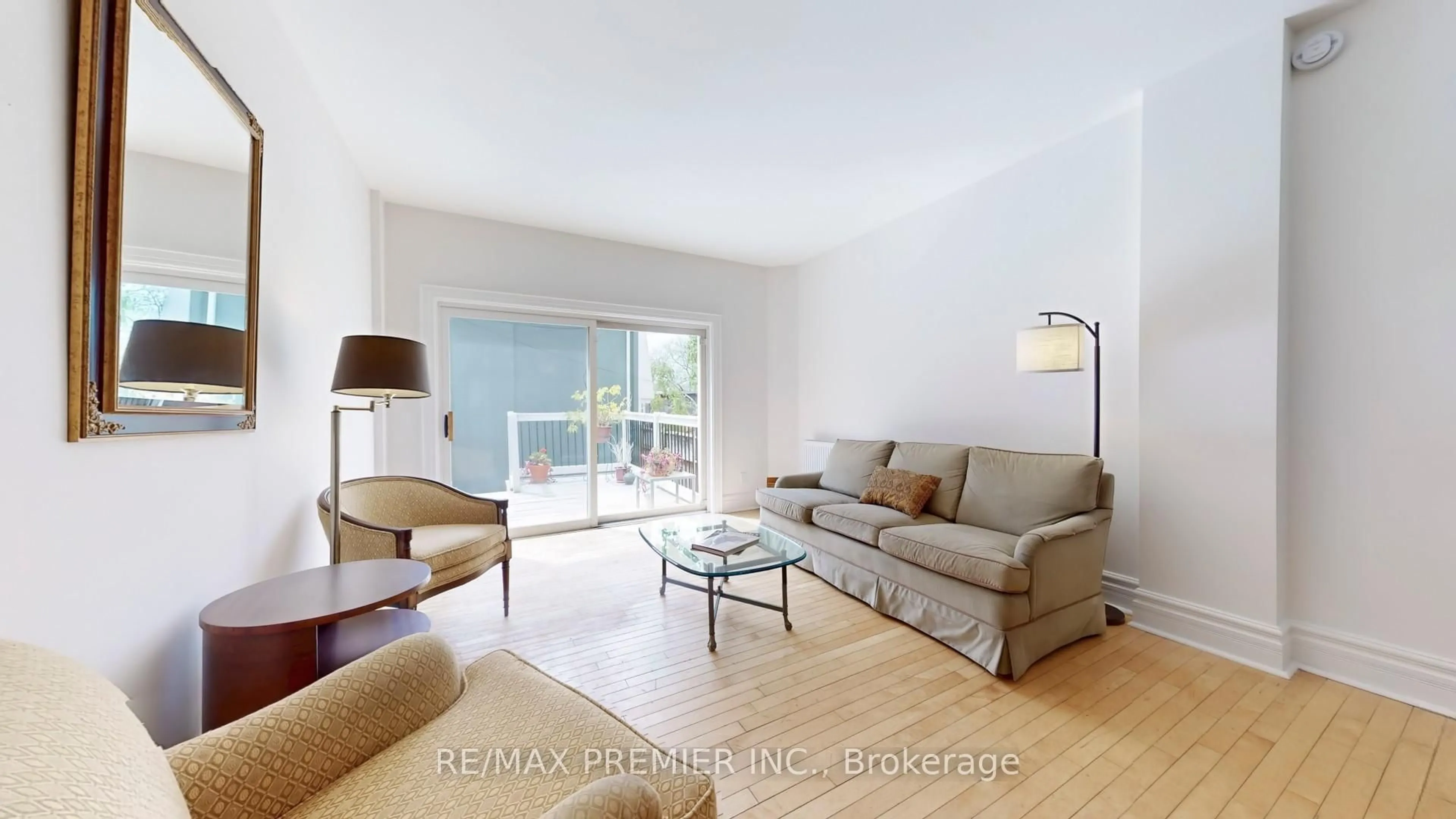 Living room with furniture, wood/laminate floor for 147 Winchester St, Toronto Ontario M4X 1B5