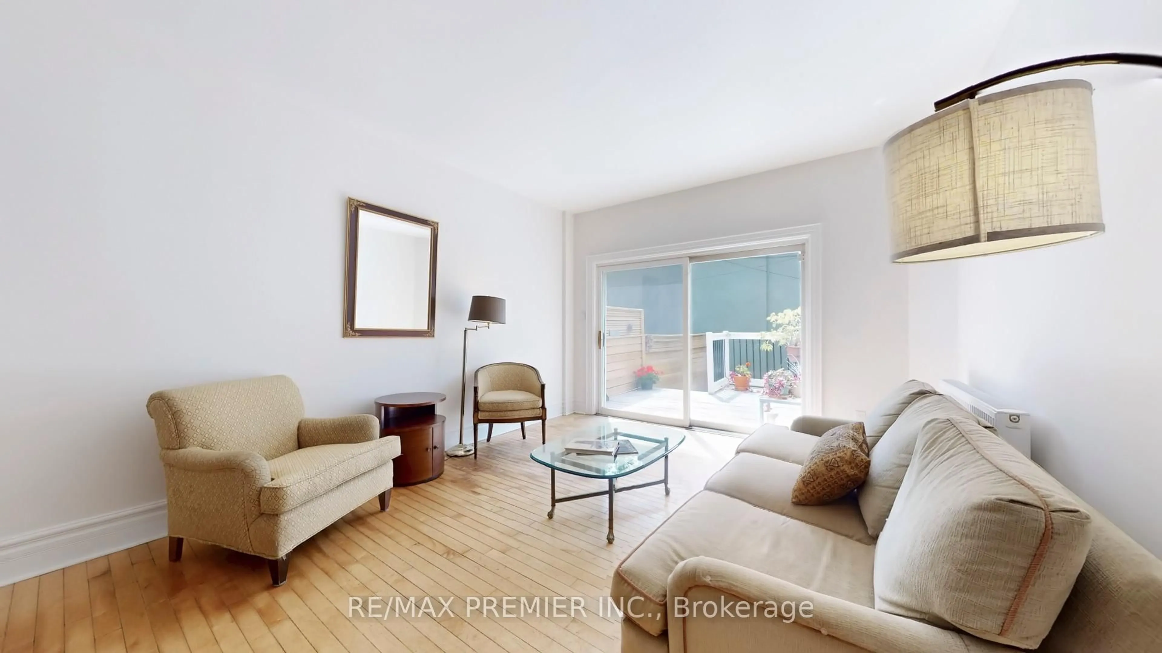 Living room with furniture, wood/laminate floor for 147 Winchester St, Toronto Ontario M4X 1B5