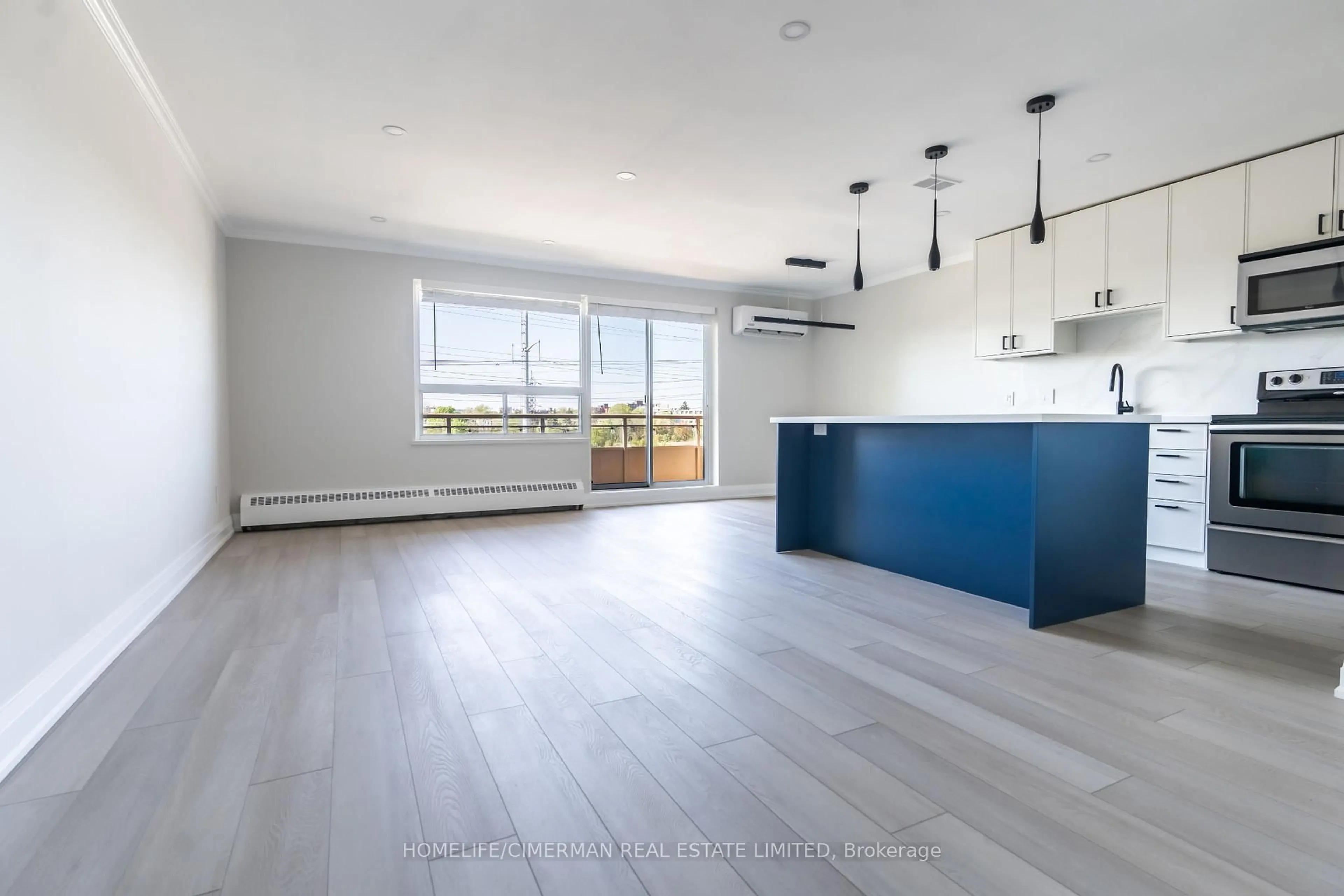 Open concept kitchen, wood/laminate floor for 71 Jonesville Cres #401, Toronto Ontario M4A 1H1