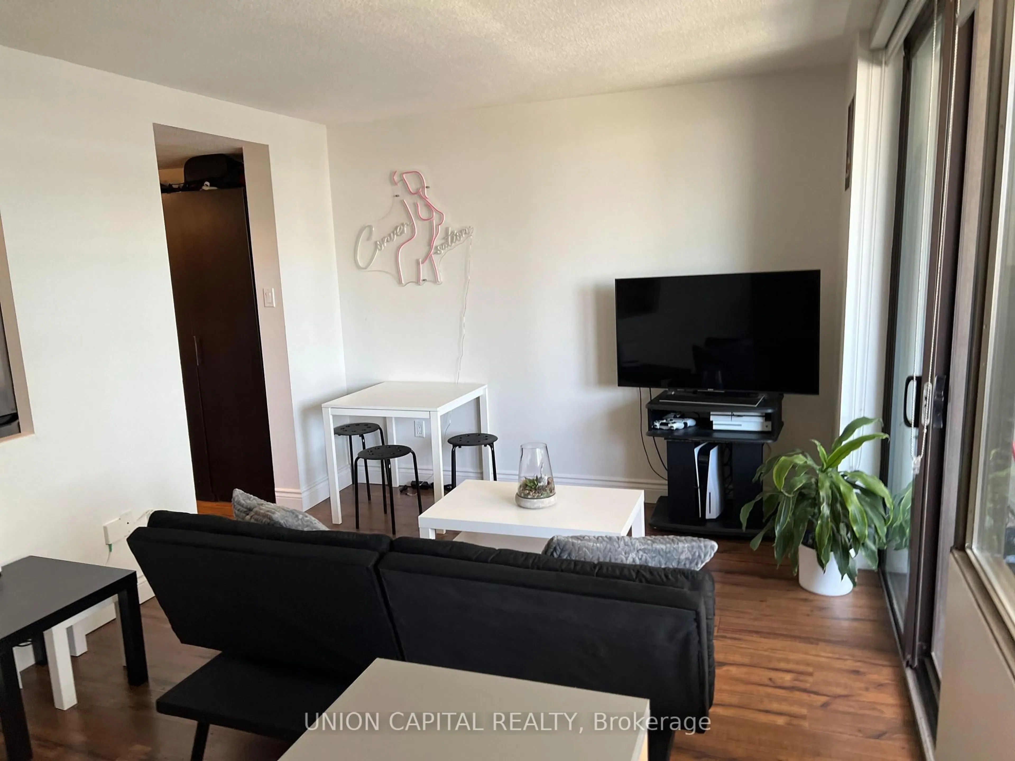 Living room with furniture, wood/laminate floor for 720 Spadina Ave #1011, Toronto Ontario M5S 2T9