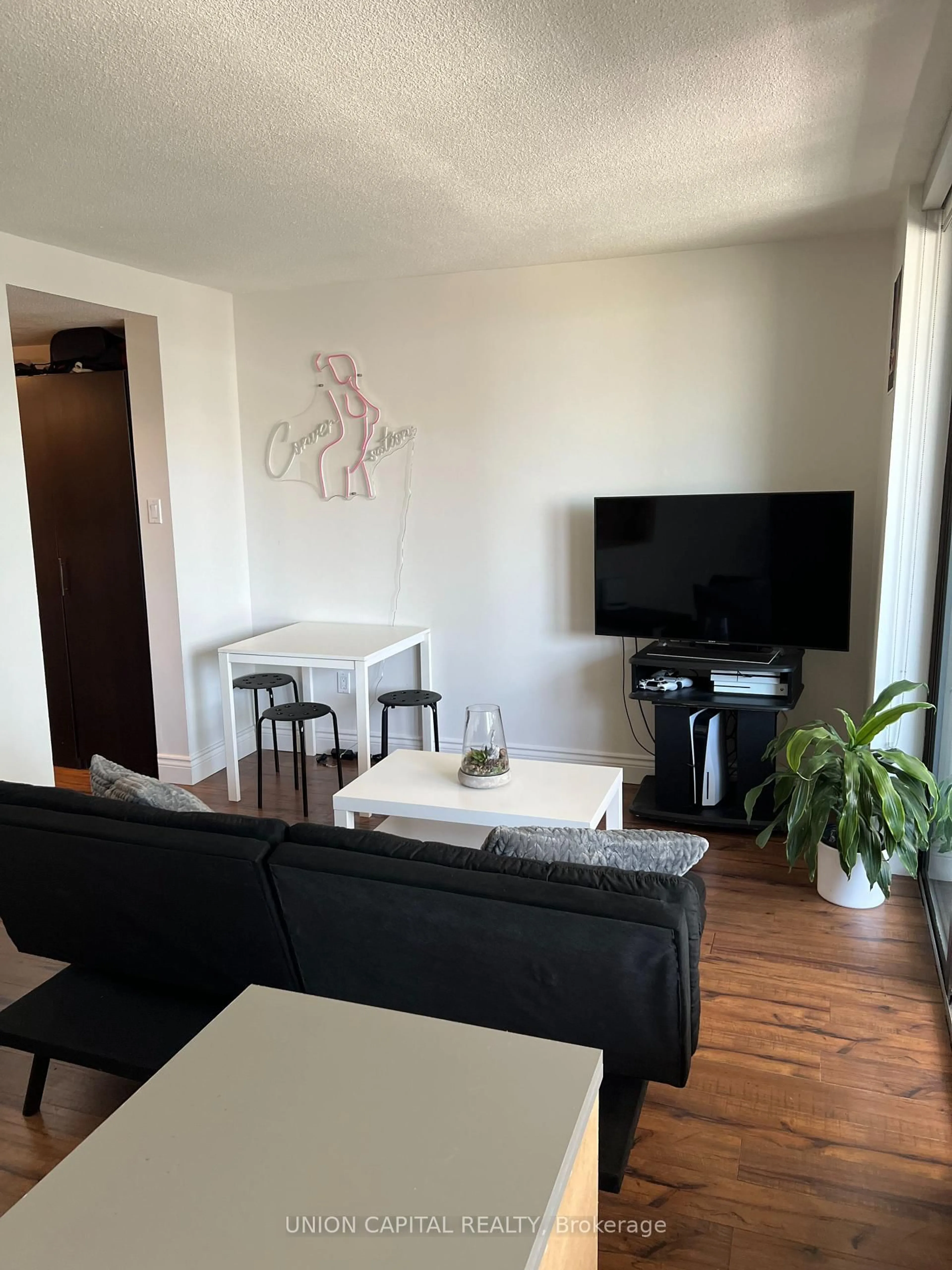Living room with furniture, wood/laminate floor for 720 Spadina Ave #1011, Toronto Ontario M5S 2T9