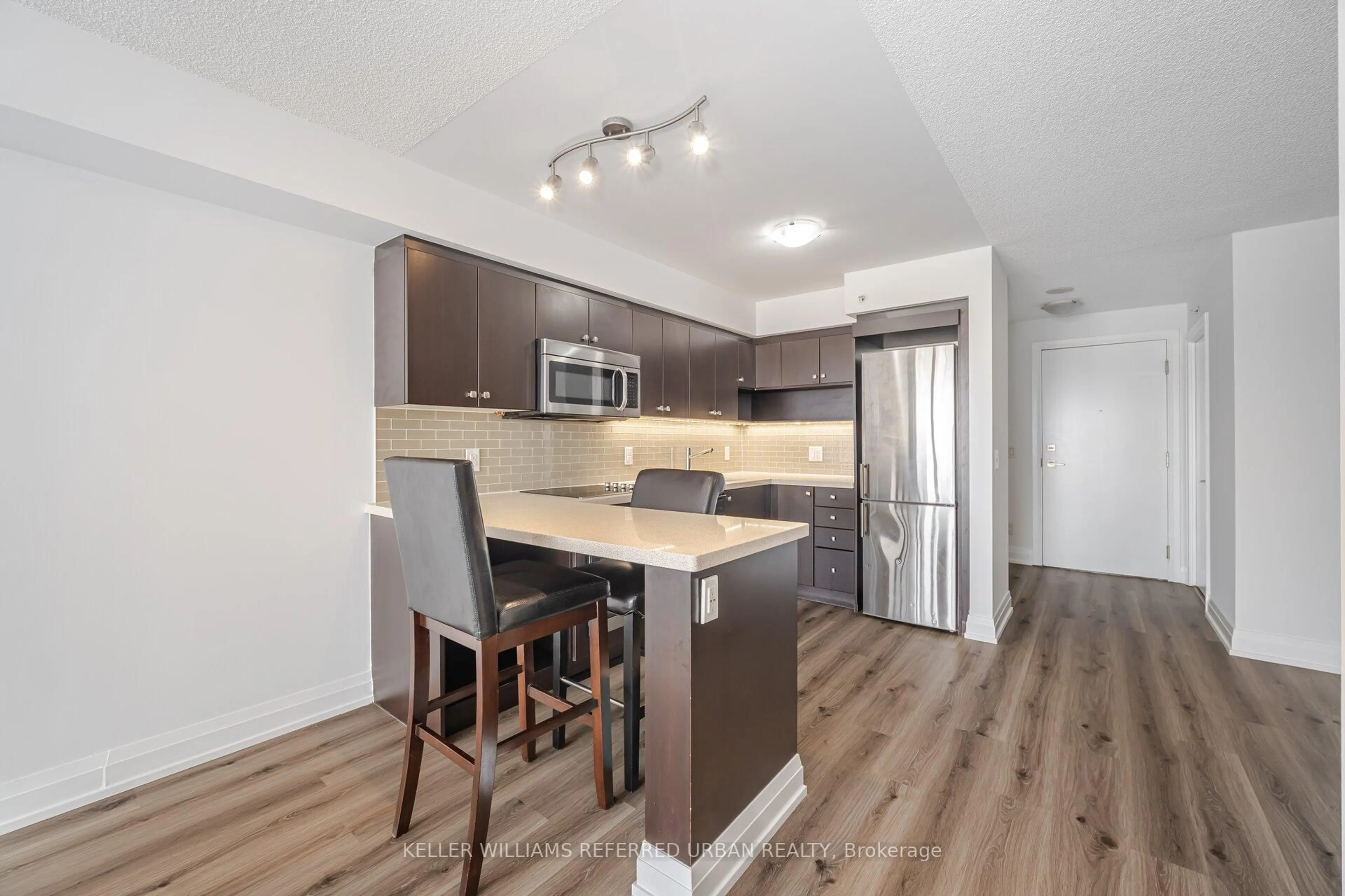 Open concept kitchen, wood/laminate floor for 565 Wilson Ave #410W, Toronto Ontario M3H 0C6