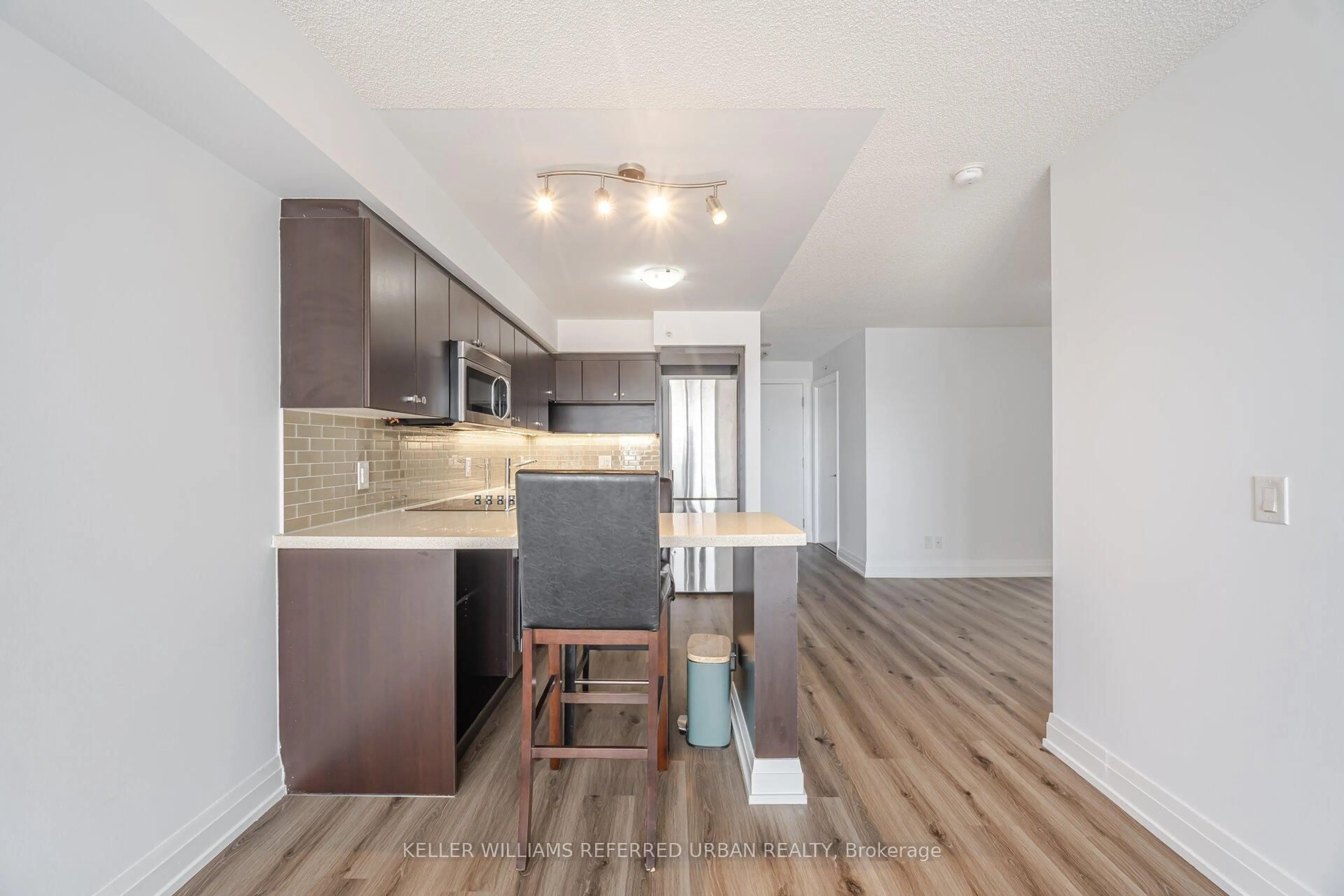Open concept kitchen, wood/laminate floor for 565 Wilson Ave #410W, Toronto Ontario M3H 0C6
