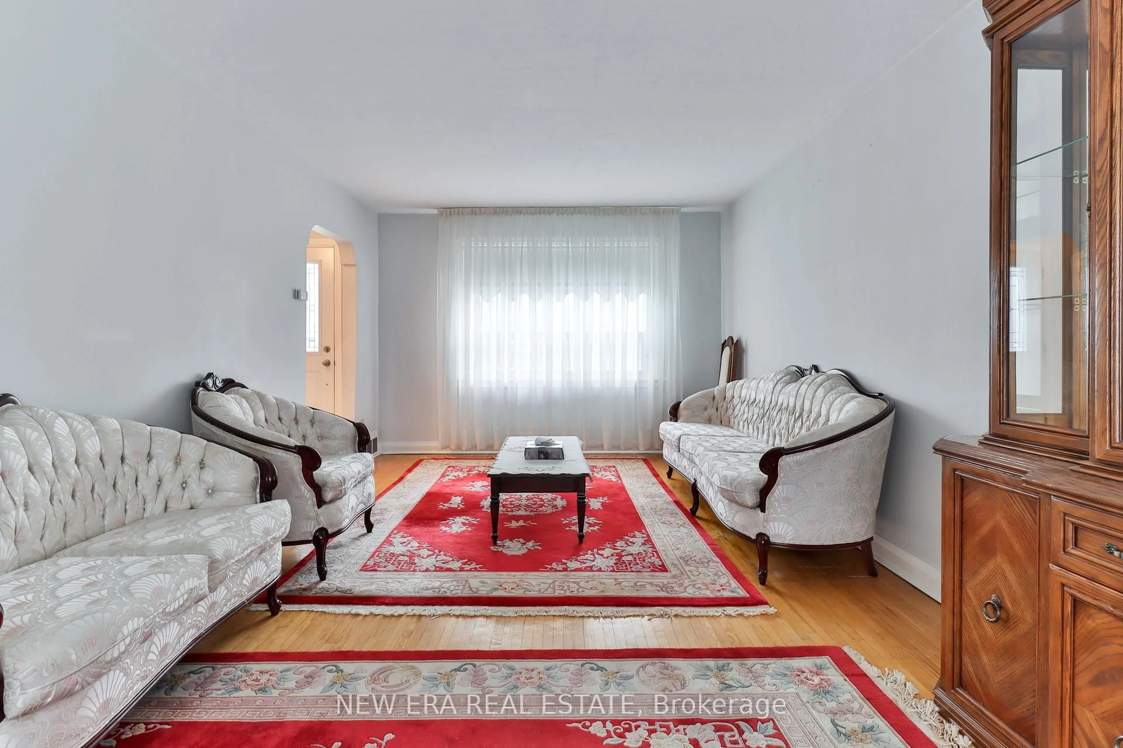 Living room with furniture, carpet floor for 27 Dell Park Ave, Toronto Ontario M6B 2T5